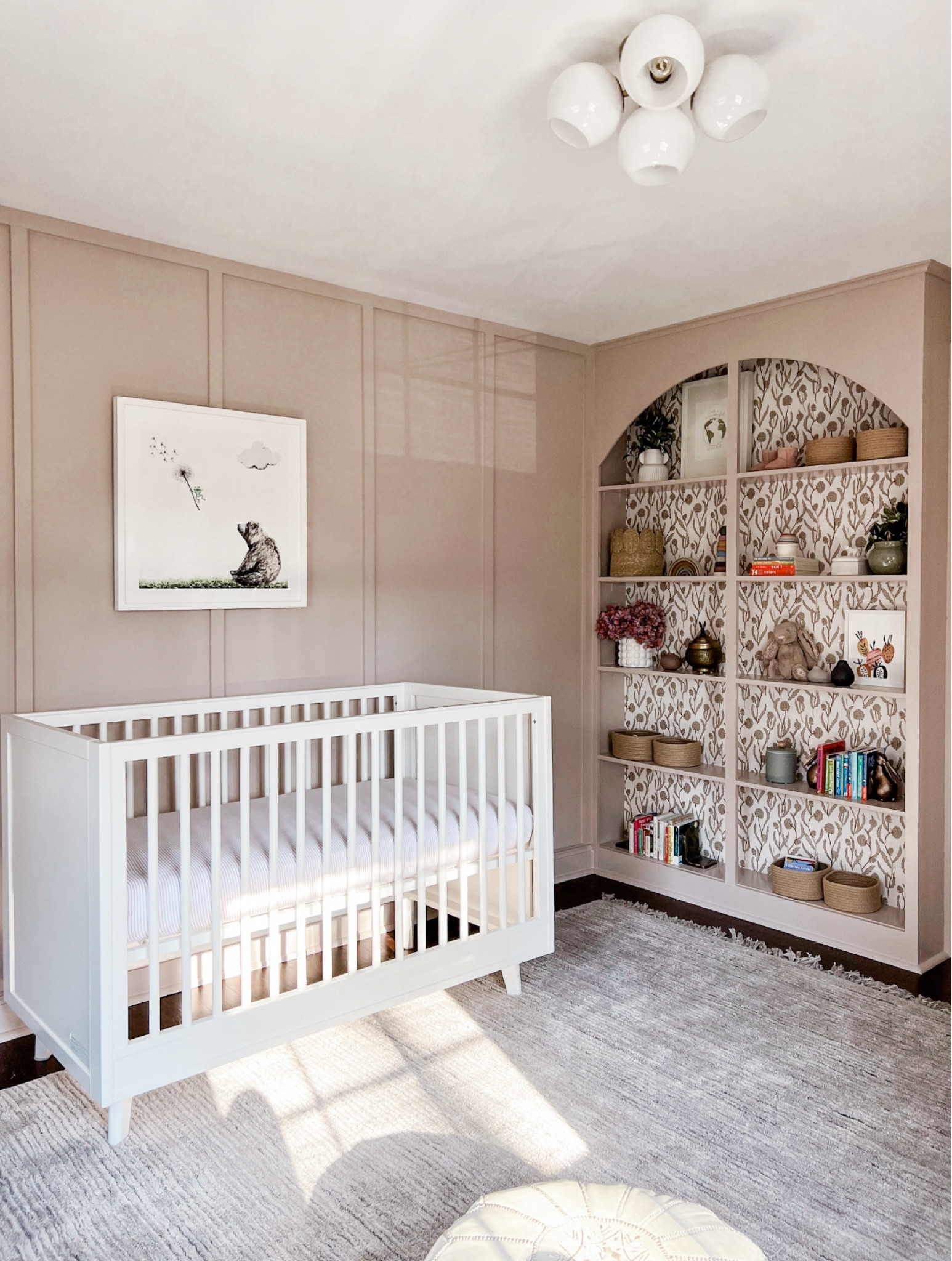 The prettiest nursery in mauve. How much fun is the wallpaper inside the bookcase?! 

#LTKBaby #LTKKids #LTKFamily