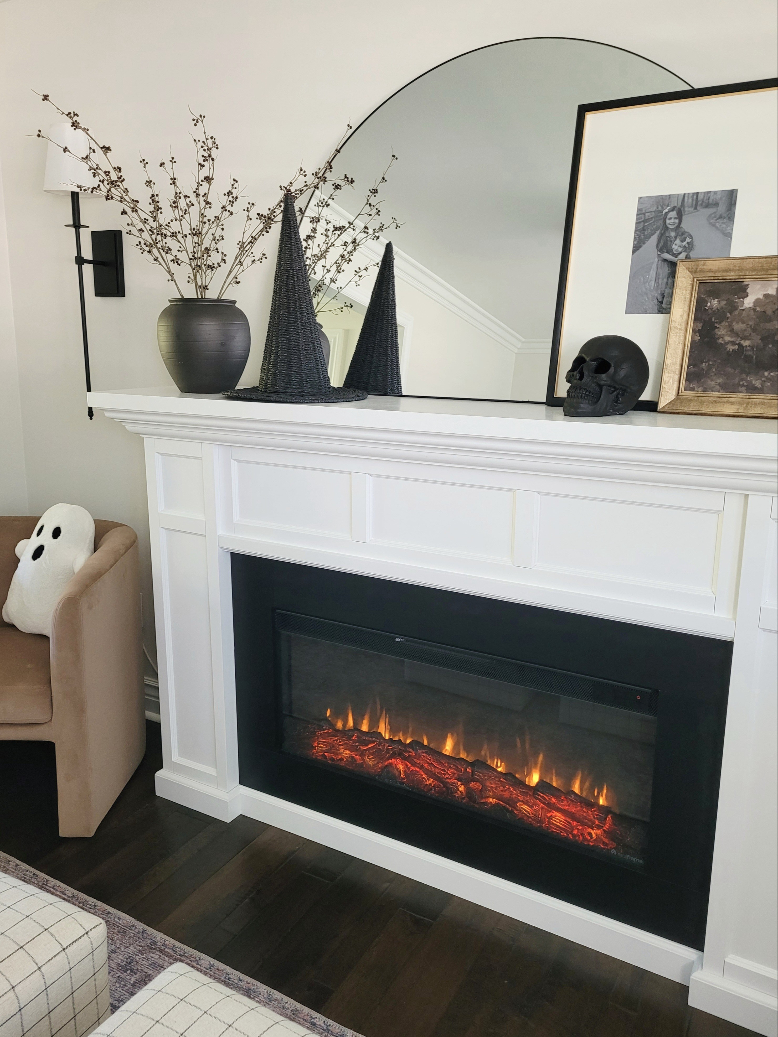 Halloween,  but make it pretty. Halloween mantle decor. Halloween decor,  witches hat,  black skull,  shelf styling,  mantle styling,  ghost pillow,  Halloween living room

#LTKHalloween #LTKHome #LTKFindsUnder50