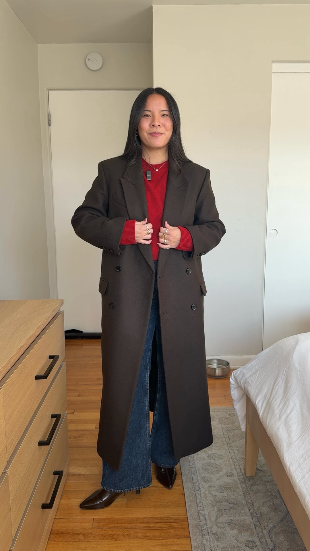 Coat: US 4
Sweater: size small
Jeans: size 24