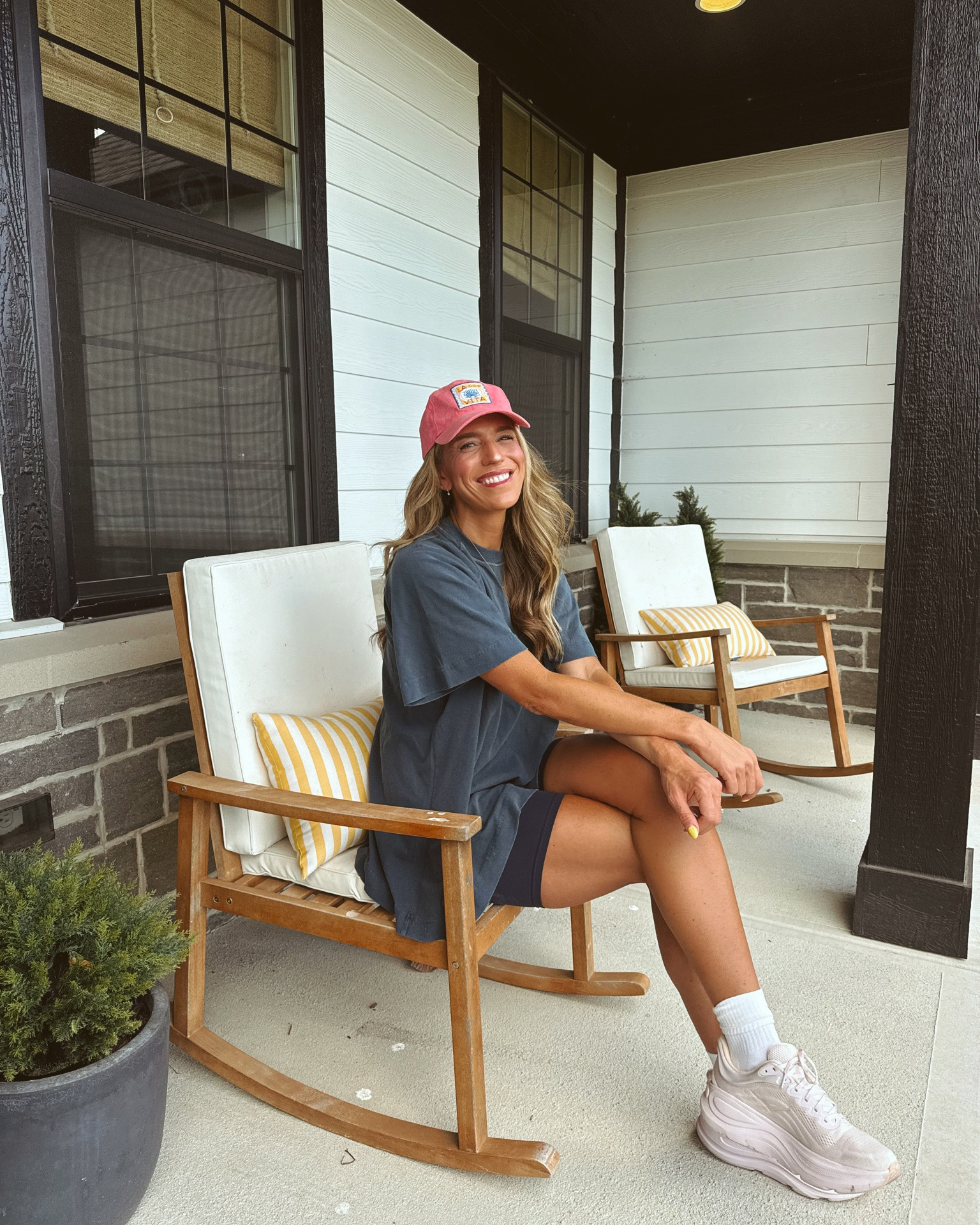 Outfit I wore working from home as a toddler mom that is super comfy for the summer. Top runs oversize. It is from FP movement and I love the Vintage field to it. I am wearing a size small. I am also wearing my favorite biker shorts they are from Athleta and I am a size small my shoe size. My hat is old from Anthropologie.

#LTKmomlife #LTKmorningroutine #LTKootd