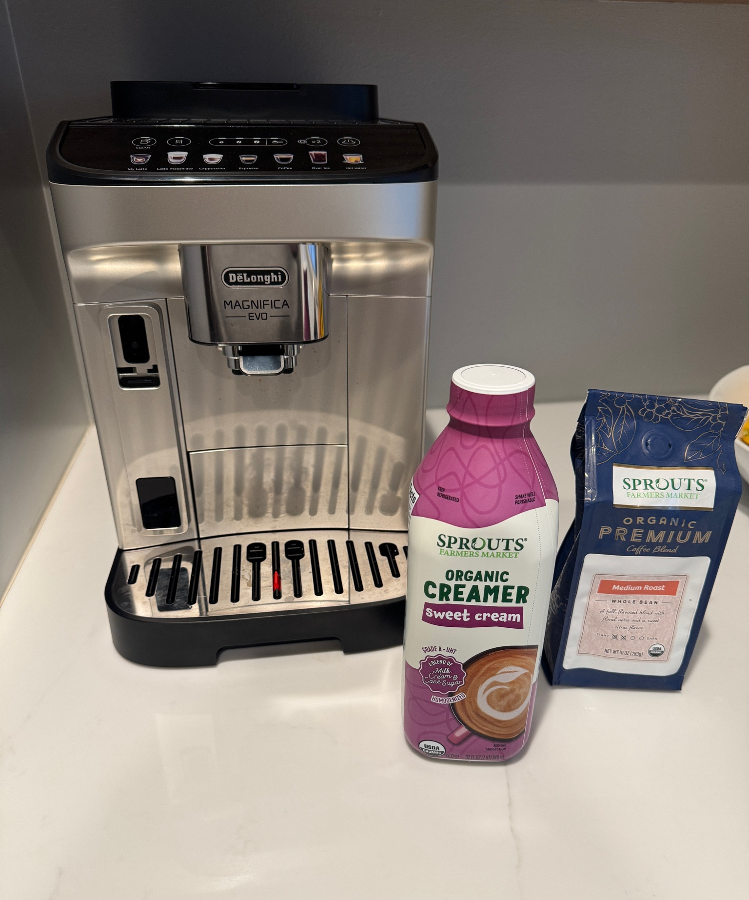 Delonghi coffee machine (not pictured: the dirty milk frother currently in my sink). This is my favorite creamer and organic coffee beans. #coffee #coffeemachine #delonghi #espressomachine

#LTKHome
