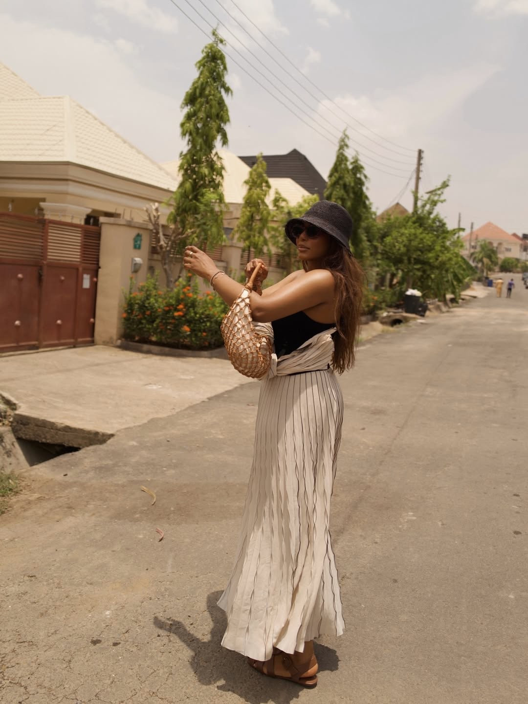 In the tropics! Wearing a cute and causal warm weather outfit that’s perfect for your next beach vacation / travel outfit. Luvette Houdini cami top, cos pants, everlane fisherman sandals, stays handbag, lack of colour hat … For more links to spring outfits 2026, easter dress women, easter outfits women, date night outfits, vacation outfits beach, spring dresses, easter basket ideas, work outfits, country concert outfits, follow me on LTK! ✨

#LTKFestival #LTKTravel #LTKootd