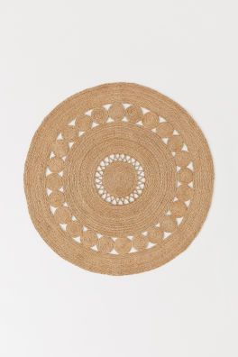 Large, round rug in braided jute with a decorative, perforated pattern.Weight7,12 kgCompositionJu... | H&M (US + CA)