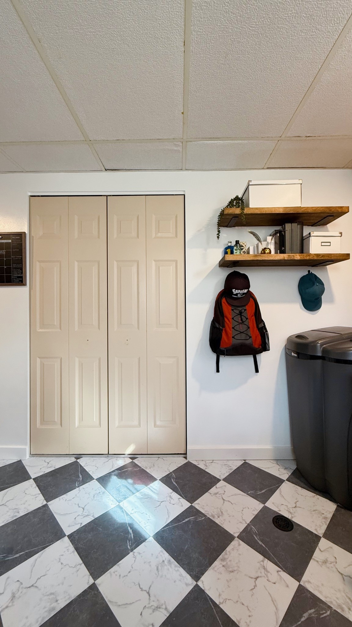 Opposite the new office is the laundry closet (now hub’s closet). Now the question is - to paint the closet door or not? I was planning to paint it the same white as the walls, but this color is kinda growing on me. This laundry room used to be all in this color - from walls to all the doors - and it just looked old and sad. But now that the walls have been painted white, that paint color just on the closet door is looking okay to me… what do you think? Help me decide! Paint white, leave as is, or paint a different color?
Linked the floors and the floating shelf bracket I used for these shelves. Don’t mind the big can on the right - that’s a water softener!


#LTKHome #LTKFamily