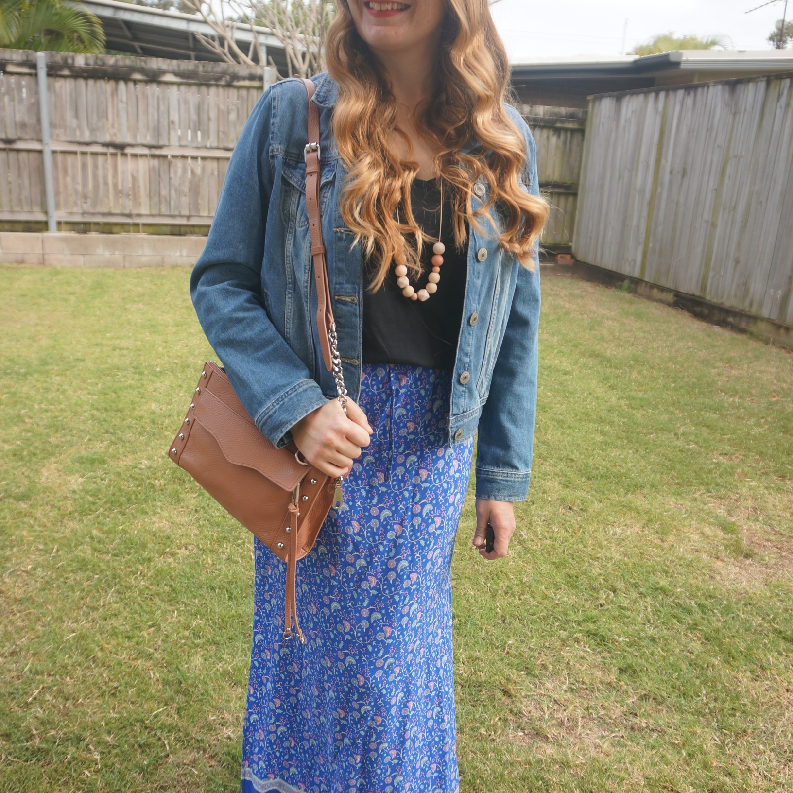 Black tee, denim jacket and floral maxi skirt with pink Rebecca Minkoff studded MAB crossbody bag 💙

#LTKspring #LTKaustralia #LTKbag