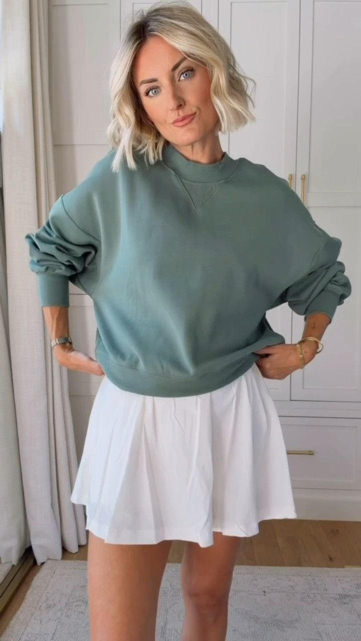 This green pullover has been really great for transitioning into Fall! I love how you can throw it on over an athletic dress for added warmth. This dress is limited in stock, but linking similar! Wearing small

Loverly grey, green athletic pullover, athleisure fashion for women, active outfits for her, target fashion finds, white active dress, green crewneck sweatshirt 

 #LTKootd #LTKSeasonal #LTKActive