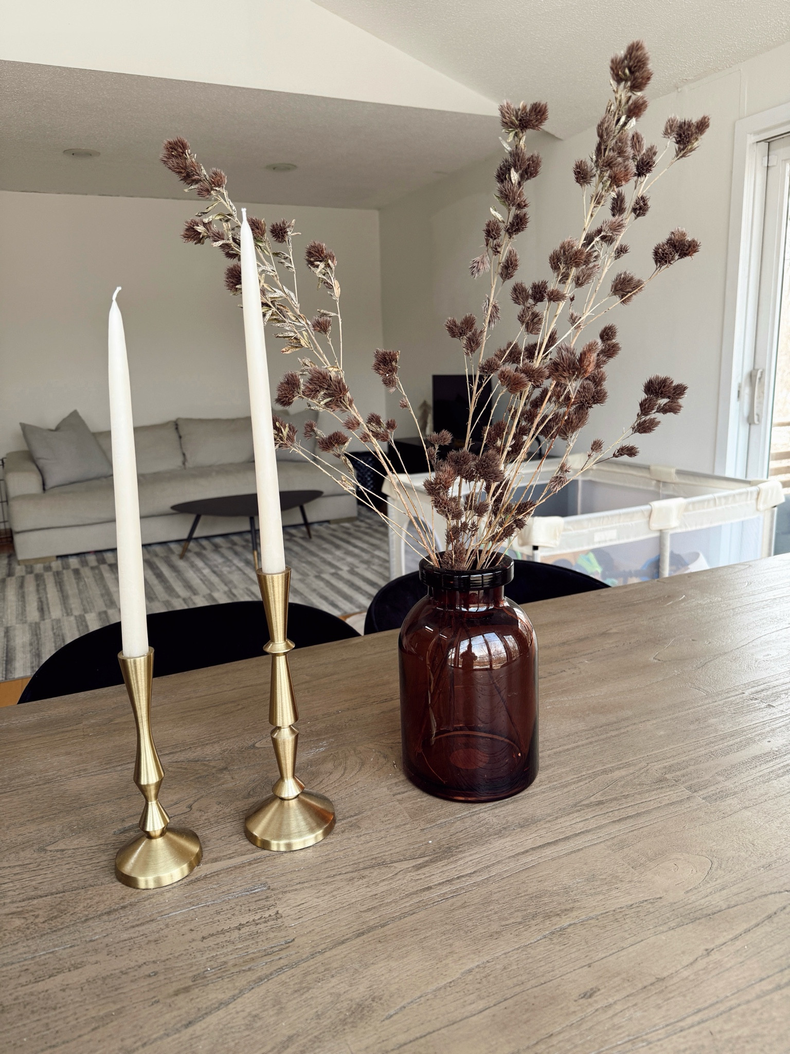 My ideal winter dining table centerpiece 🤎 love adding candle sticks during the colder months and switching out my vase and stems! I don’t have a fireplace mantle so this is where I have my fun with decor! 

#LTKHome #LTKFindsUnder50