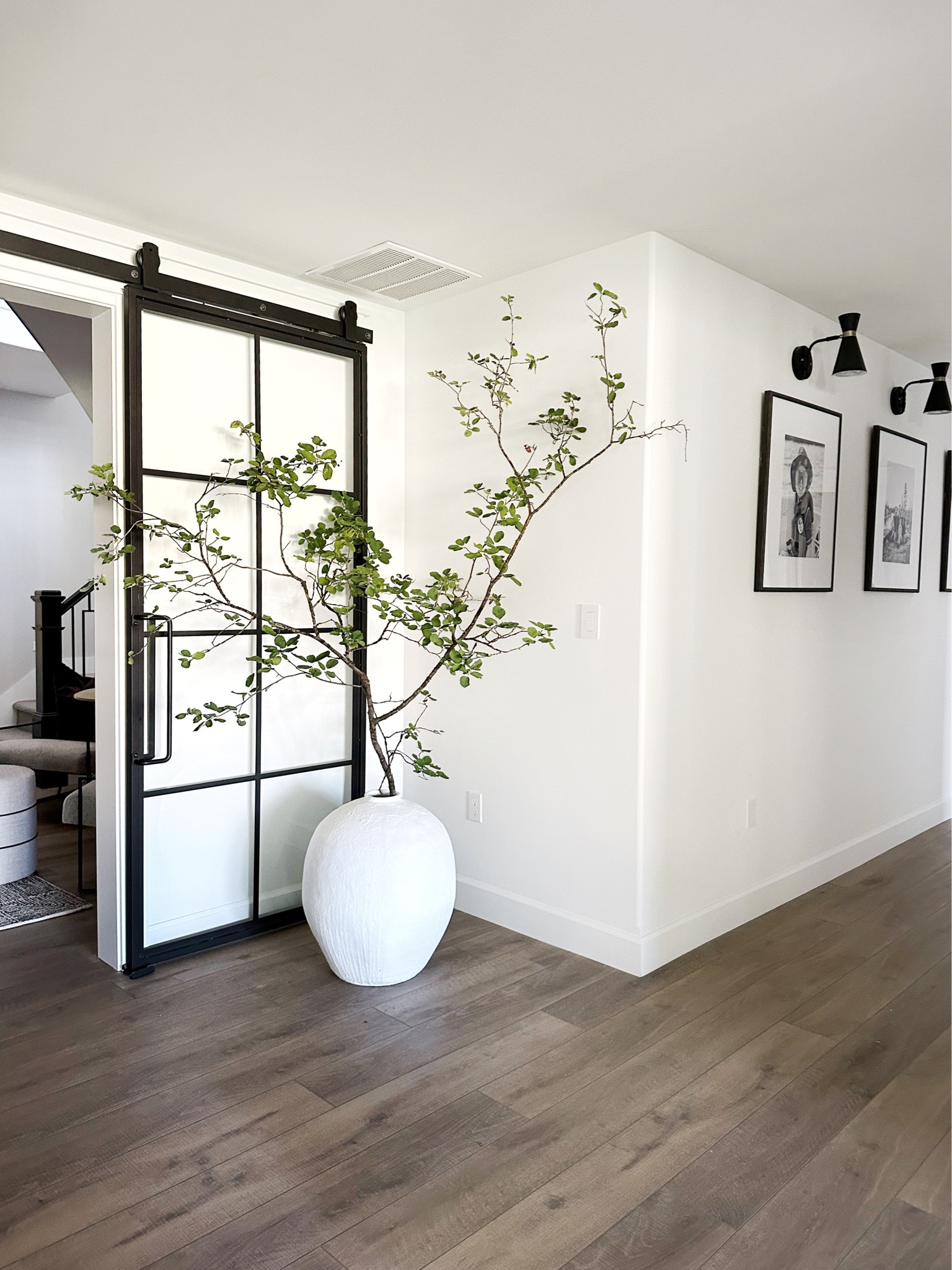 Isn't she pretty! 

I have been searching for the perfect corner piece for this little area and so happy she's here! The tree is real from my backyard but am actively looking for one to replicate this look because 🤩🤩!!

I love filling up corners with vases or tall pedestals. I debated on what to do here but in the end this large vessel stole the show. 
How to shop! 
1.  Comment SHOP to get a message with links
2. Click link in my BIO @ourpnw_home and click SHOP MY INSTAGRAM
3. Shop in the LTK APP @ourpnw_home 
#ltkhome #homedecor #howyouhome #inspireme #interiors #interiordesigner #styleinspiration #stylediary #neutralstyle #neutraldecor #homeinspiration 

#LTKunder100 #LTKhome #LTKitbag