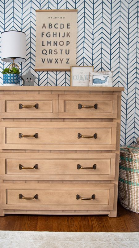 Little boys bedroom with patterned wallpaper, large wood dresser, seagrass storage basket, and other fun home decor items for kids bedroom, coastal style home decor

#LTKhome #LTKkids #LTKfamily