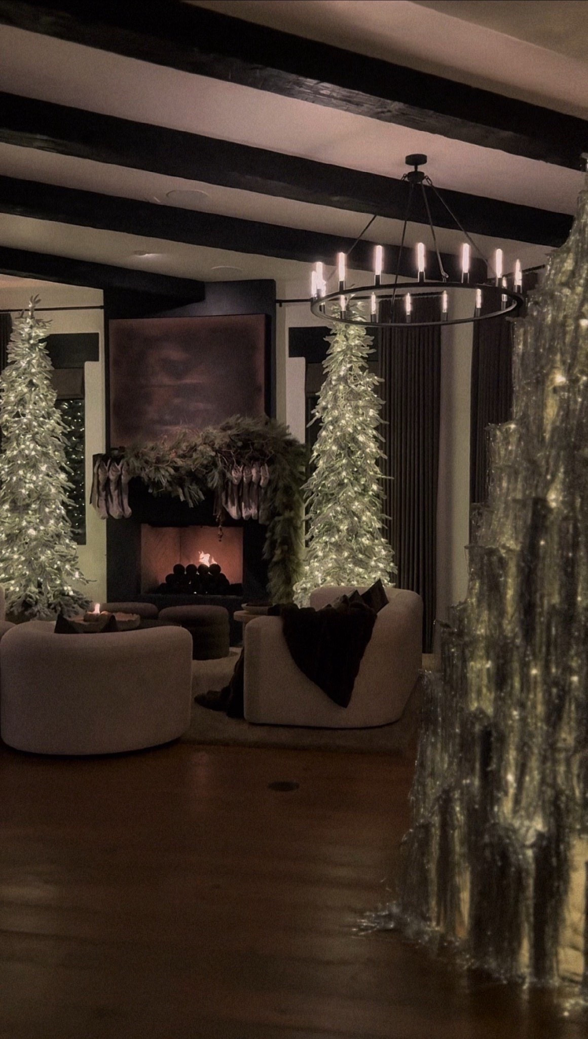 Moody holiday magic ✨ Layered garlands, tall lit trees, and soft boucle chairs bring this living room to life. A cozy, elegant take on Christmas styling that feels timeless and warm.

#MoodyHolidayHome #NeutralChristmasDecor #CozyChristmasVibes #ElegantHolidayStyle #WarmWinterDecor #AmazonHolidayFinds #ModernChristmasLook #HolidayLivingRoom #MinimalHolidayStyle #SeasonalHomeInspo



#LTKSeasonal #LTKU #LTKHoliday