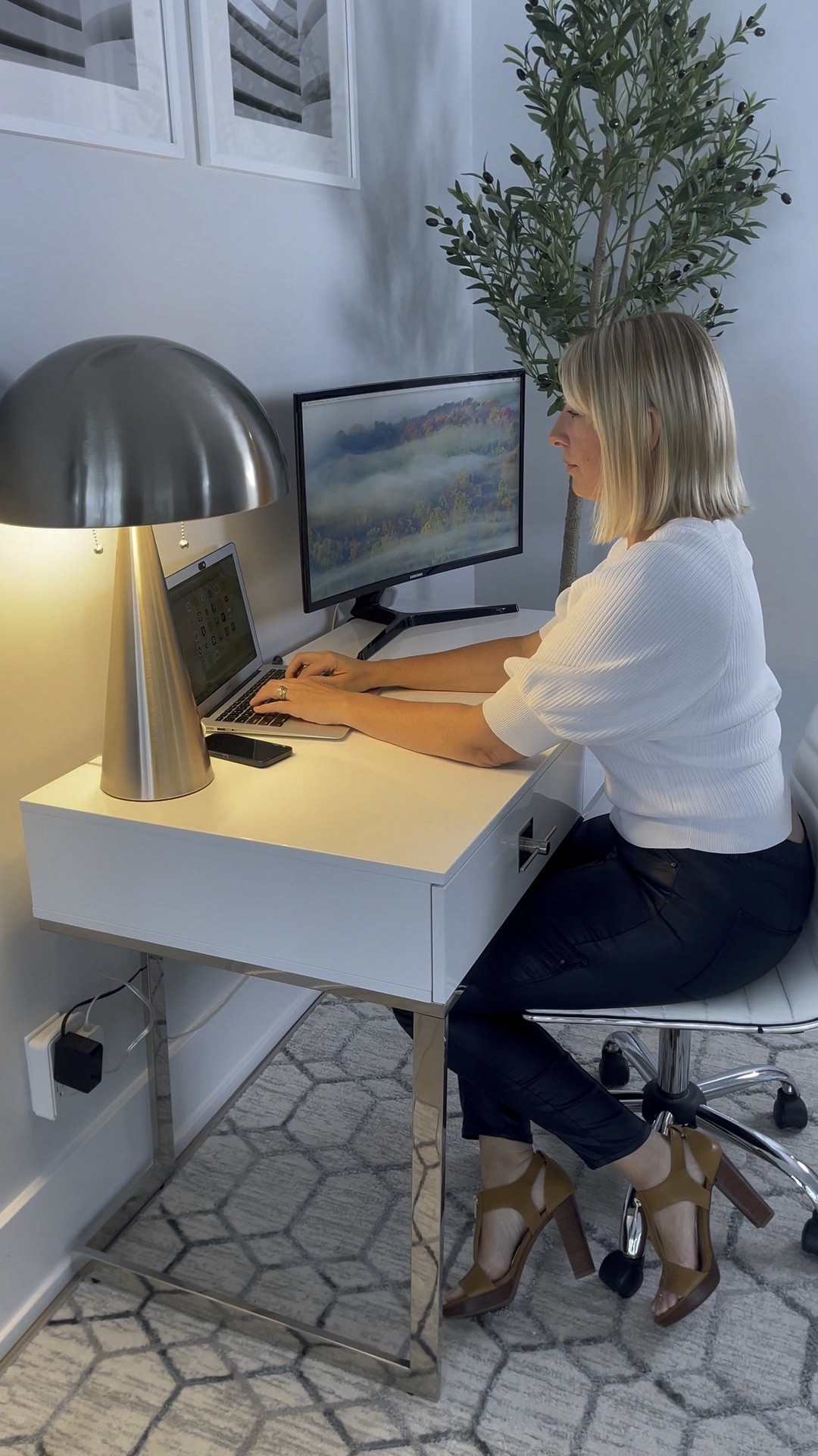 Before and after home office. My home office was a hot spot for me. I'm not sure how my entire home is spotless, but this space always seems to be where everything falls.

With the Cassandra Writing Desk from Inspired Homes, my 'Hot Spot' area is no longer. The desk has two spacious drawers that are both wide and deep. It allows me to store a variety of desk essentials, including; standard office supplies, notebooks, computer, paper, and so much more.

The Neveah table lamp provides the right amount of light, allowing me the freedom of choosing between one light or two. It also is equipped with a built-in, USB, charging port, making it easy to charge my phone while I work at my desk. #ad #gogetinspired #InspiredHomeCo #HomeDecor #HomeDesign #interiordesign @Shop.LTK @inspiredhomeco 

#LTKworkwear #LTKVideo #LTKhome