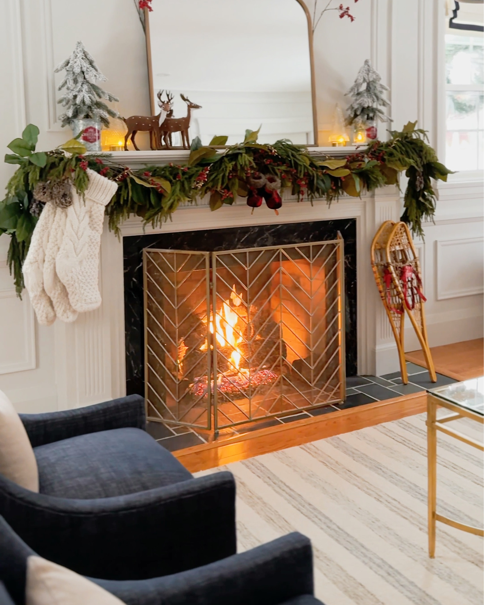 Christmas decor, living room furniture, holiday decorations | large mirror, cozy rug, Loloi rug, Chris Loves Julia rug, cable knit stocking, realistic garland, faux garland, magnolia garland, traditional decor, vintage Christmad decor

#LTKwinter #LTKholiday #LTKhome