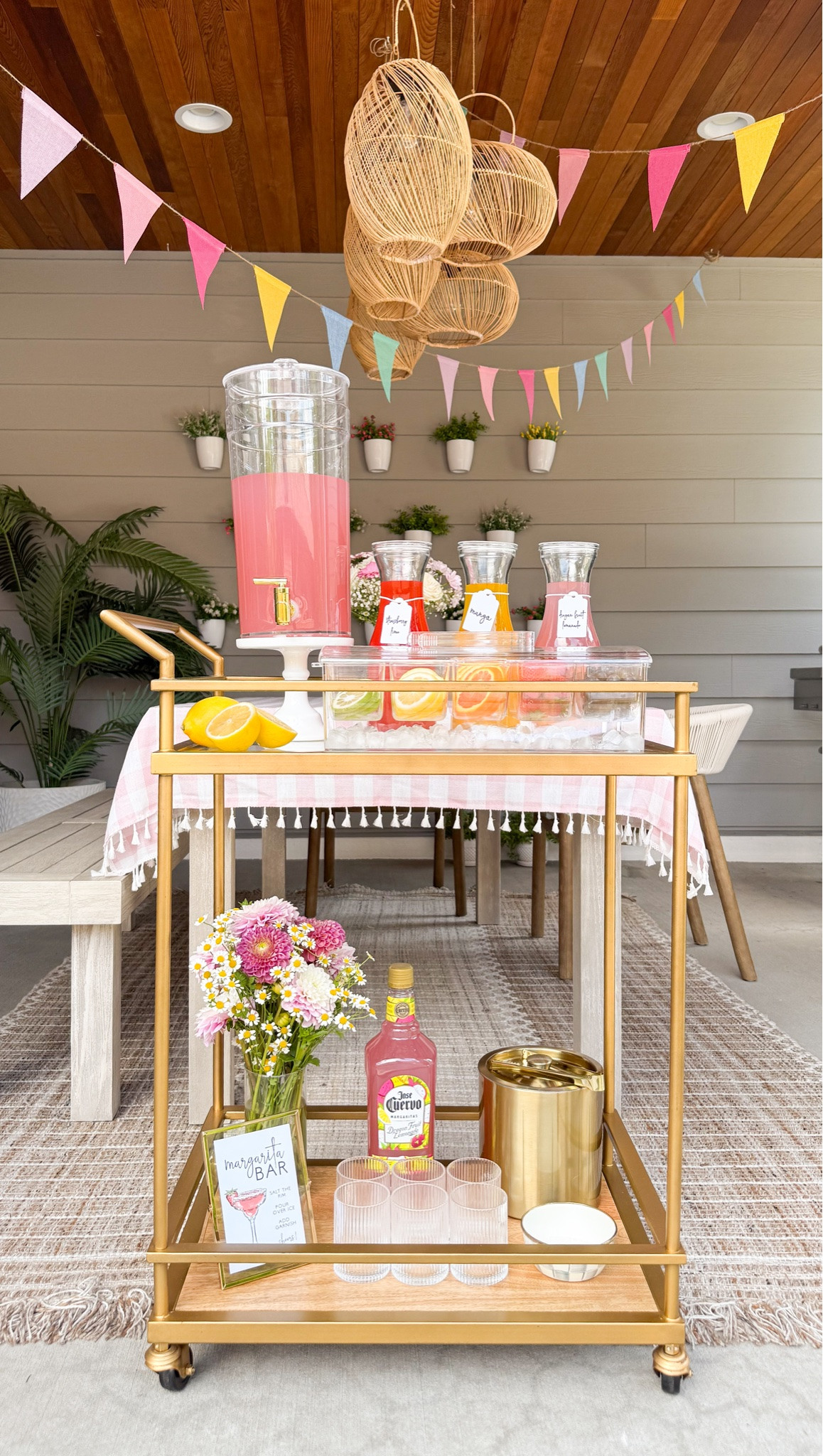 DIY MARGARITA STATION! 

Bar cart, glassware, bowl, metal ice bucket, server caddy, glass carafe, pink checkered tablecloth, outdoor furniture, table, chairs, rug, planter, patio furniture, rainbow flag banner 

#LTKParties #LTKSeasonal

#LTKsummer #LTKhome