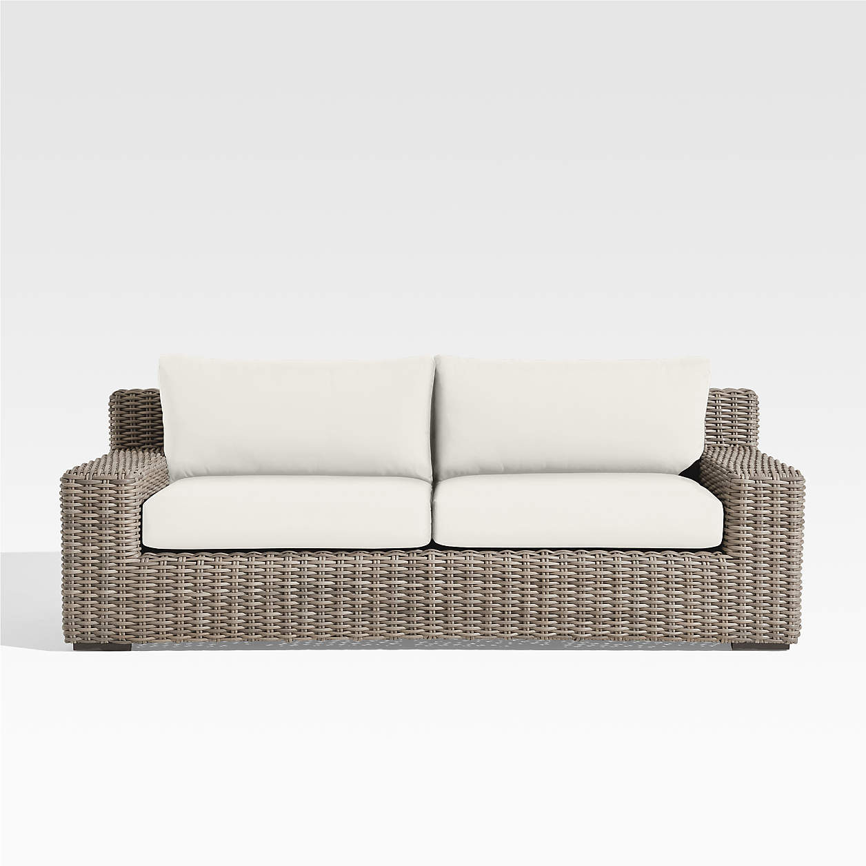 Abaco All-Weather Resin Wicker Outdoor Patio Sofa with White Sunbrella Cushions + Reviews | Crate... | Crate & Barrel