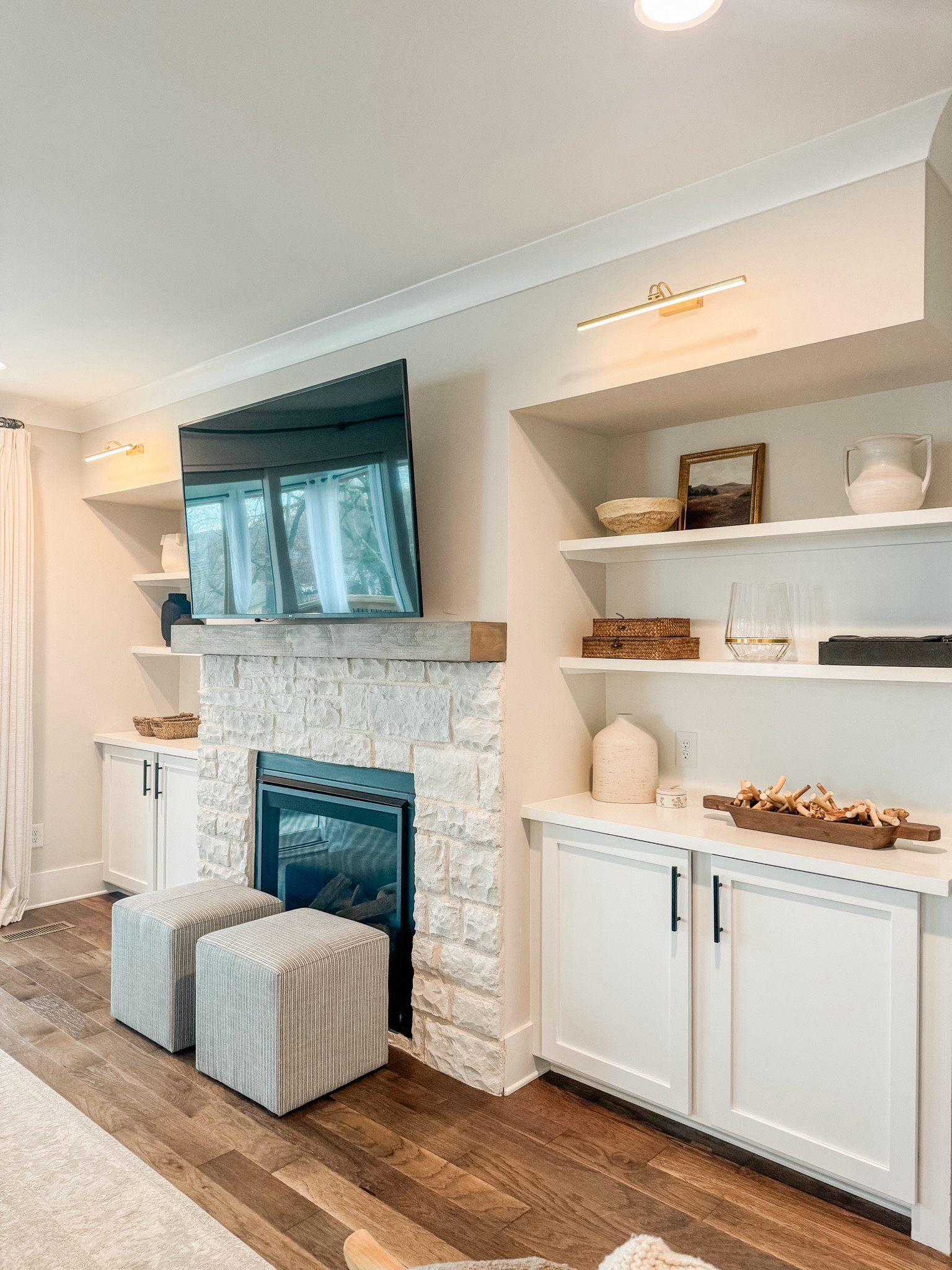 My fireplace builtins and Amazon battery operated picture light 

#LTKStyleTip #LTKFamily #LTKHome