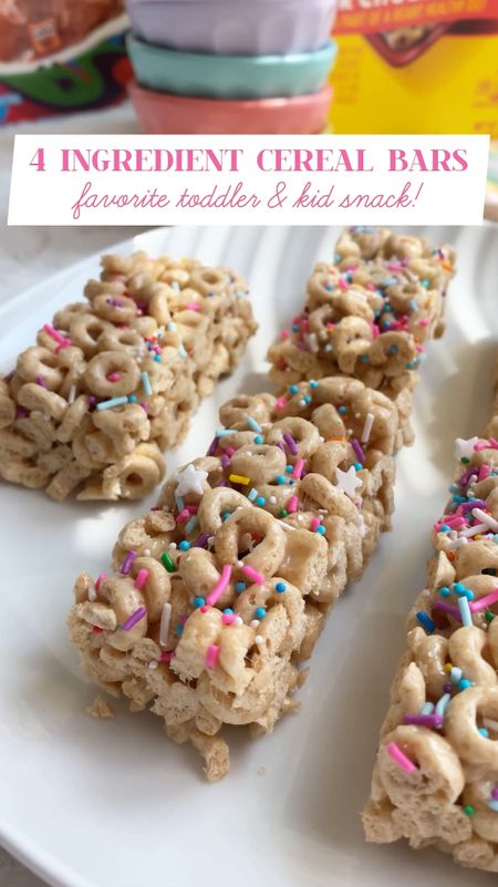 Easy 4 ingredient cereal bars perfect for snacking, lunchboxes, and summertime treats! 
Toddler and kid approved & no baking, these bars are quick to make and perfect for satisfying hunger cravings.

* 8 tablespoons unsalted butter
* 10 ounces marshmallows
* 6 cups Cheerios cereal
* Sprinkles 

In a pot melt the butter on medium heat then add in the marshmallows and mix until completely melted.
Mix in the Cheerios until completely coated. 
Press the mixture into a 9x13 inch pan 
Add sprinkles and let cool completely before serving.


#family #recipes #home #kitchen 

#LTKVideo