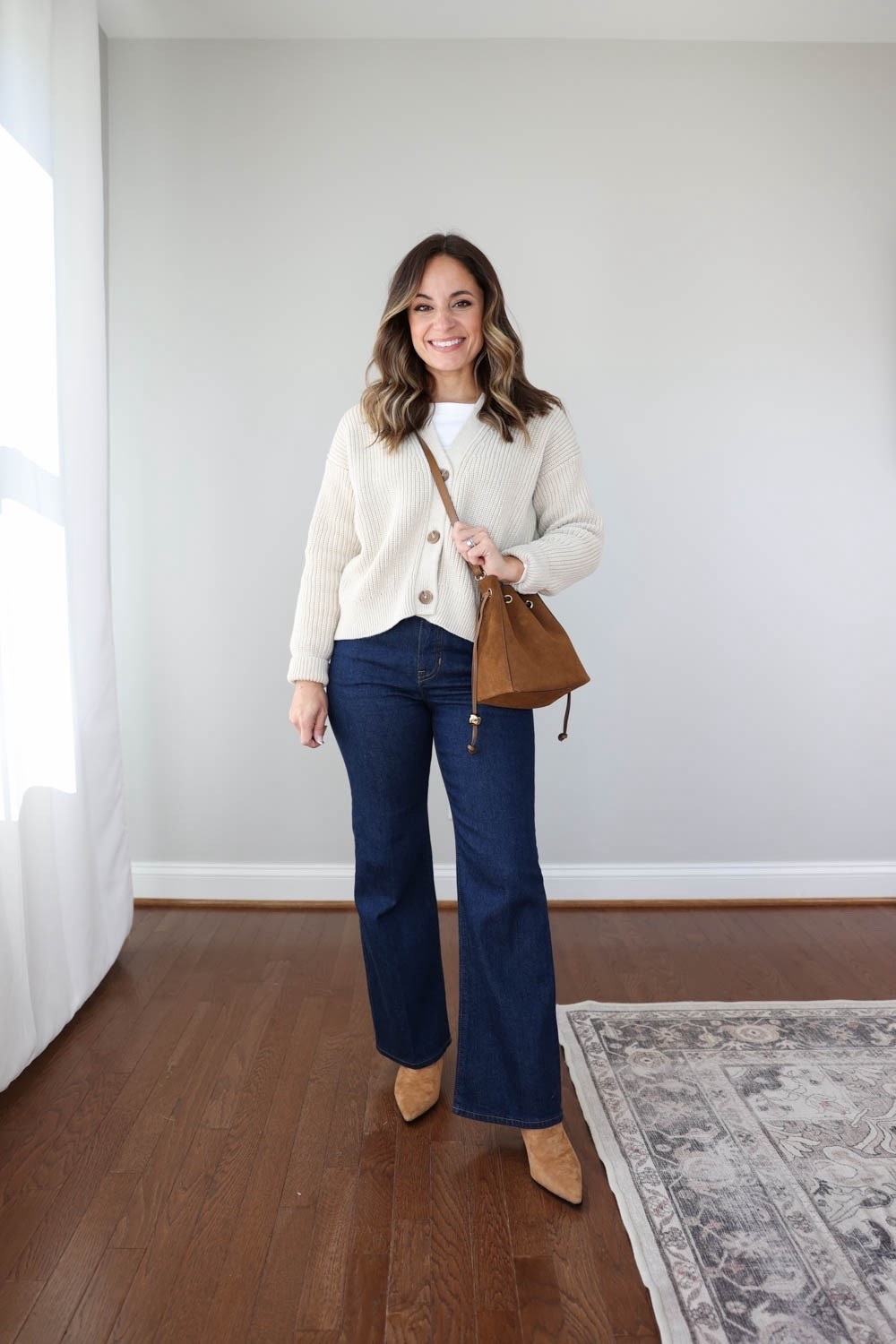Flare Jeans styled for every season! 

J.Crew Charley Kickout Cropped Jean 
Size Wearing: 24 classic in rinse 
Fit: true to size - extra room at the waist
Inseam: 27.5″ in classic | 25.5” in petite 
Rise: 11.5” in classic | 10.5” in petite
Fabric & Care: 99% cotton/1% Lycra® spandex. | Machine Washable
White top (J.Crew Factory): xxs 
Sweater (Quince): xs in speckled beige 
Boots (J.Crew): tts 
Bag (Madewell) 


My measurements for reference: I’m 4’10” and 105lbs. My bust, waist, and hip measurement is 32”, 24”, and 36”.

#LTKPetite #LTKxMadewell