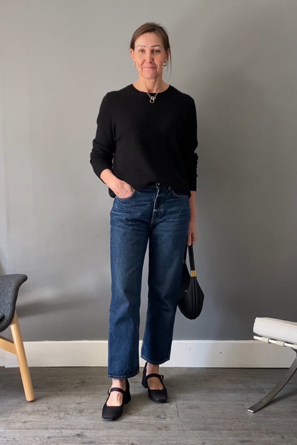 Black cashmere jumper and classic dark denim straight jeans with Mary Janes 