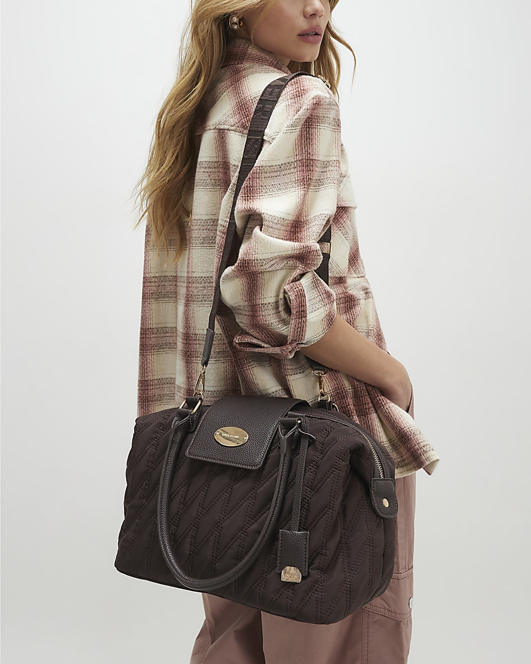 Brown Flap Top Quilted Travel Bag | River Island UK & IE