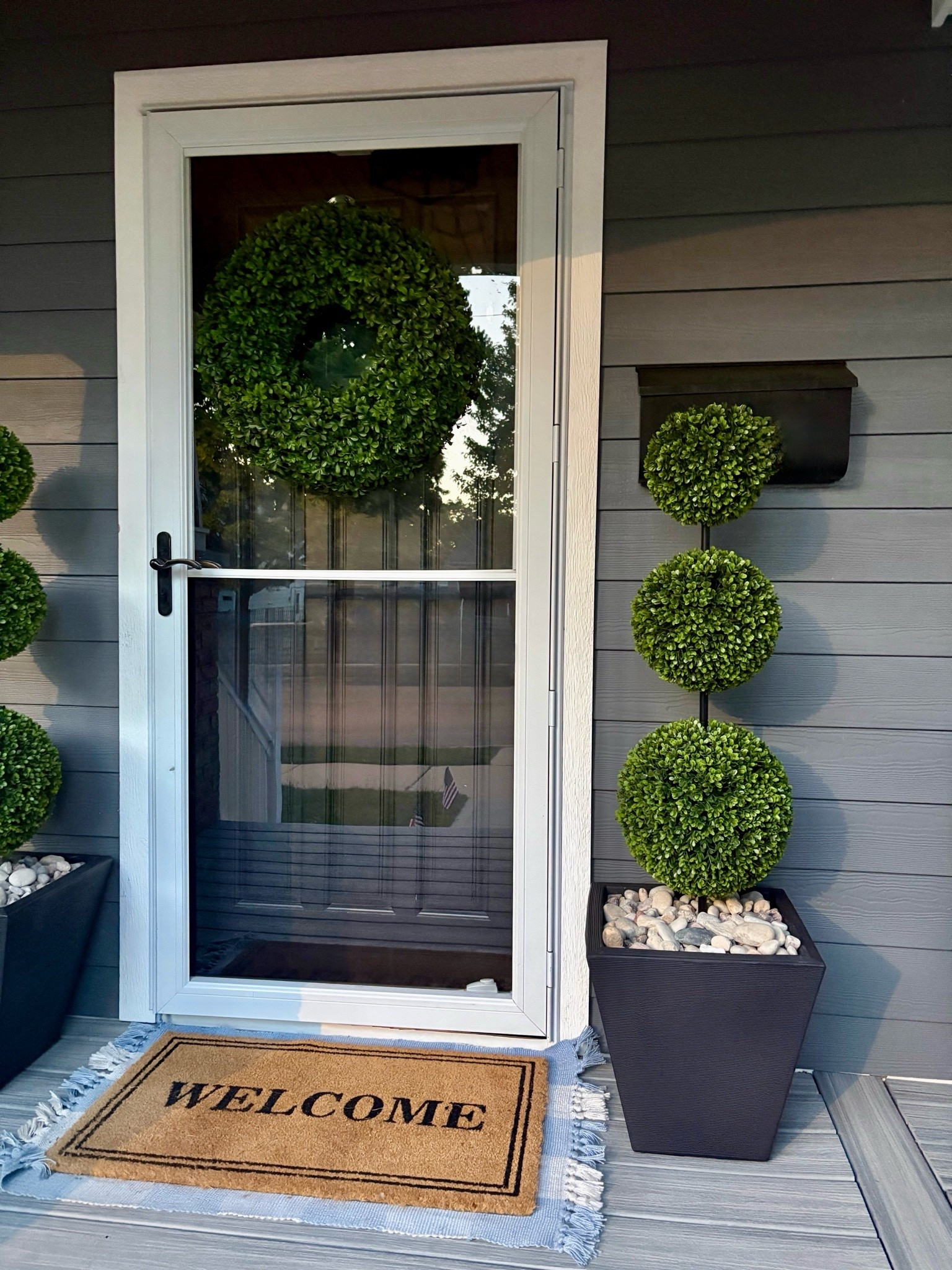 Porch refresh with my artificial topiary