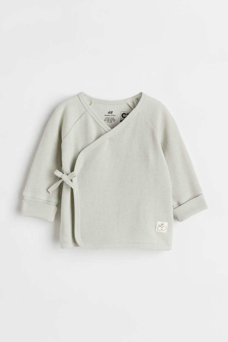 Cradle to Cradle Certified® Gold. Top in soft cotton jersey. Wrapover front with ties at one sid... | H&M (US)