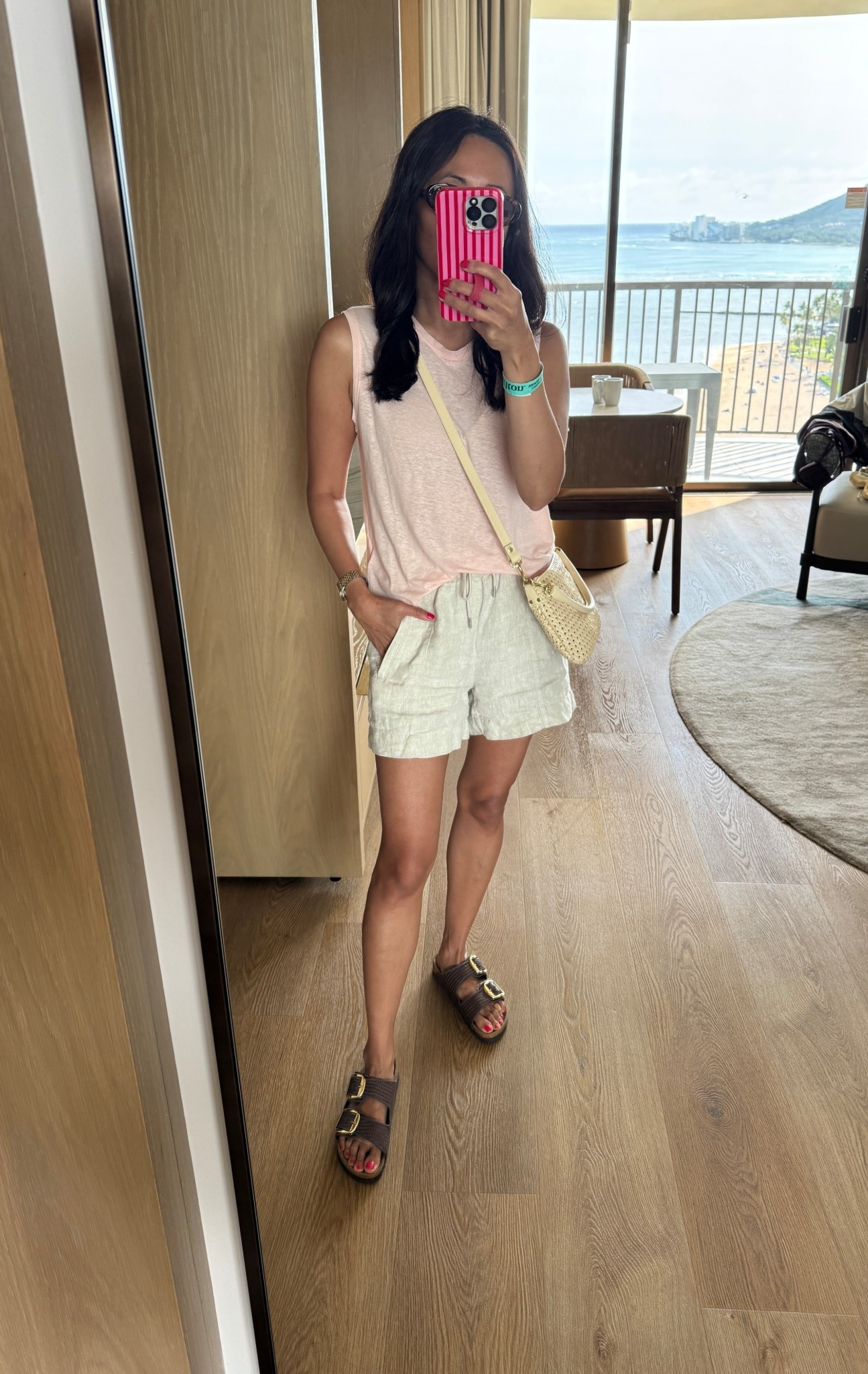 Vacation outfit. Spring break. 
Linen blend tank top is a favorite for years. This is a new color. True to size. Easy breezy. 
Linen shorts have zip pockets an high elastic waist. I size down. 
Slide sandals. Woven Birkenstocks. 
Woven handbag  

#LTKOver40 #LTKootd #LTKTravel
