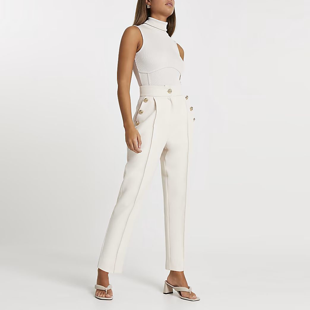 Cream button front peg trousers | River Island (US)