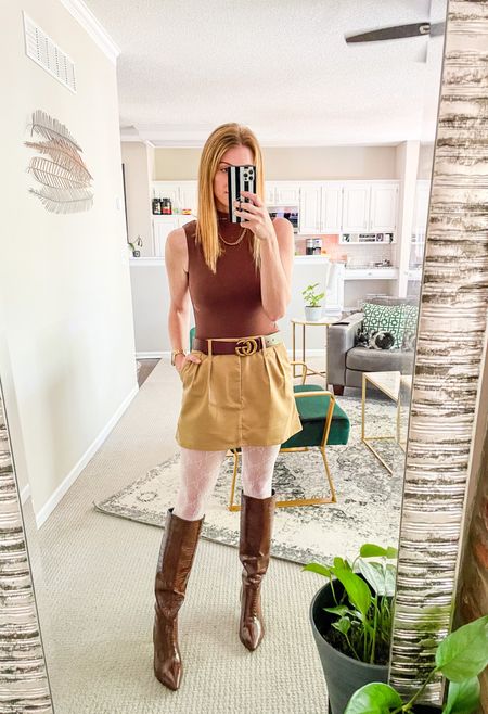 Trying to make it feel like fall even though the weather is 80 degrees. Chocolate bodysuit and matching croc boots, a khaki skirt, and some white tights to lean into the fact I haven’t seen a spray tan in ages  

#LTKfindsunder50 #LTKshoecrush #LTKSeasonal