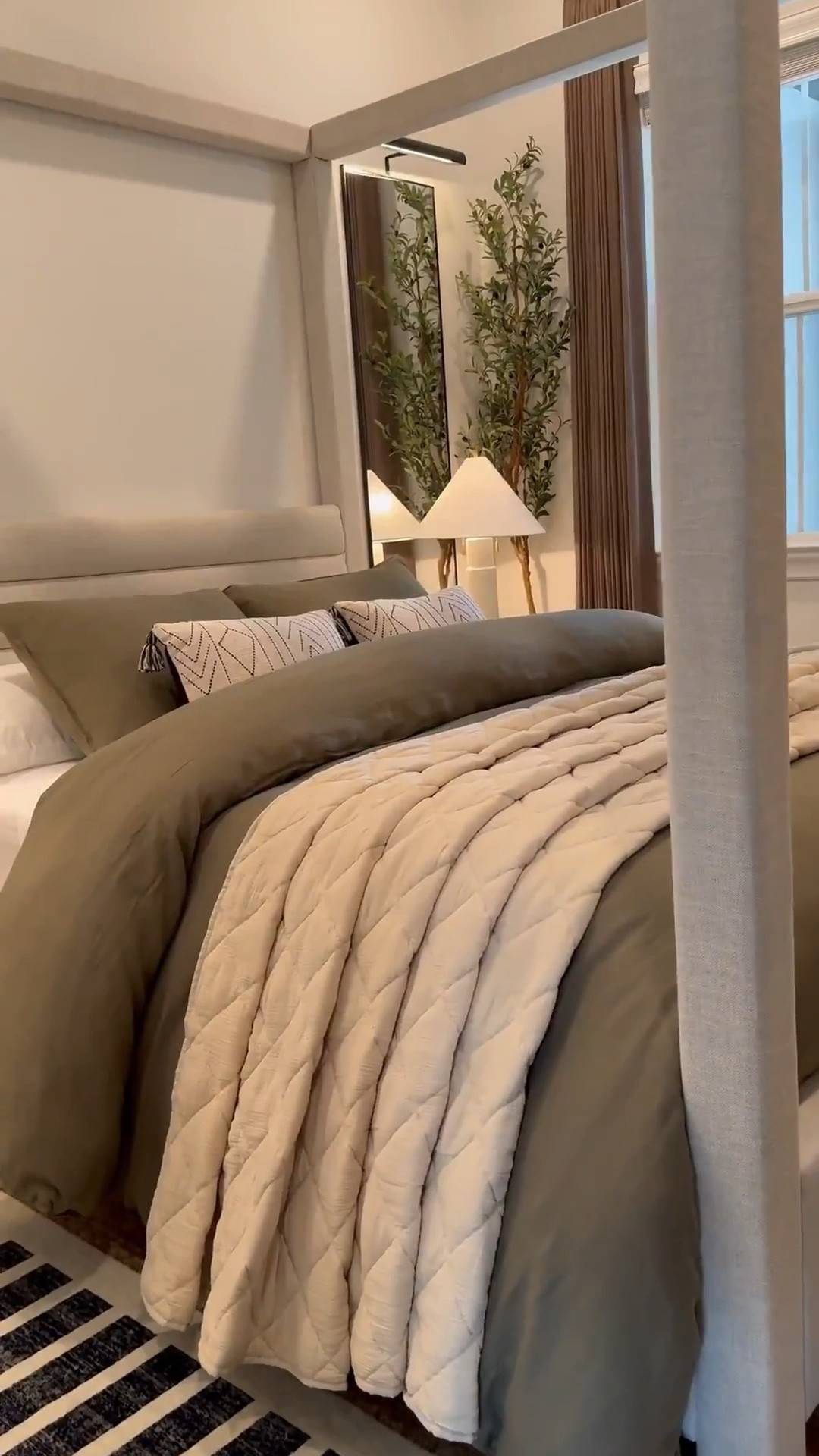 I used two duvet inserts to create that fluffy look.. plus i added a throw blanket under the rolled part! 🤎 Bed size is a Queen and the duvet+inserts are King size. I like sizing up on bedding bc it gives more fabric to work with especially if you want your bed to look full around! 😊

Measurements: 

Bed: Queen 

Duvet: King size - I inserted 2 King sized down inserts to give the bed a fuller look. Sheets & pillows are Queen sized 

Mirrors - 58" H x 18" W……mirrors will make your space feel larger as well as reflect light to other parts of the room! 

Drapes: Color Cafe Brown … Size 40"W x 108" W 

Sideboard in front of the bed was bought internationally but I linked a similar one below - Great price too!! 🤎

I used the “small table lamp” (linked) to create the glow effect behind the planter. I recommend  warm white light bulbs 😊

#LTKSaleAlert #LTKStyleTip #LTKHome