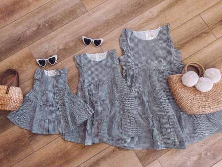 Mommy and me summer dresses! 💃 Would be perfect sun dresses for graduations, Memorial Day weekend, Fourth of July or a summer wedding! Comes in navy blue gingam, white eyelet & a few other colors. Love the tiered style & amazing quality. From one of my fave sustainable brands on amazon! Also linking our straw bags and heart sunglasses. 

#LTKunder50 #LTKfamily #LTKkids