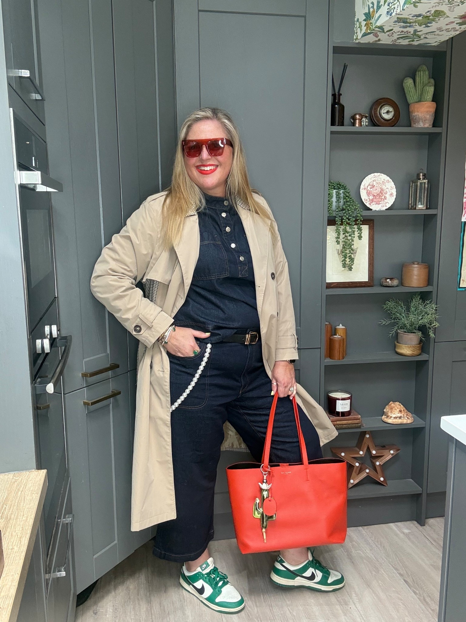 Dark denim cropped jeans, dark denim shirt, green Nike dunks, orange sunglasses, orange toe bag, pearl chain, trench coat 

#LTKplussize #LTKspring #LTKjeans