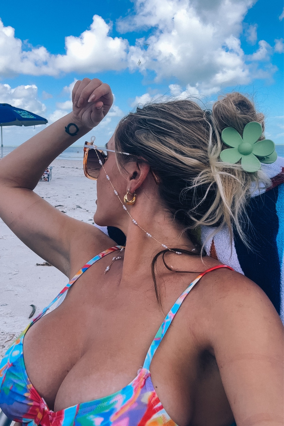 Beach Bum Life 🌊☀️ My new favorite bright abstract bikini swimsuit (Shein find!) wearing size large top & XS bottom (I did have to buy two suits to get my right sizes!) super cute under $2 Daisy floral claw hair clip, and Pearl gold glasses chain, paired with gorgeous gold globe huggies earrings 

#LTKswim #LTKtravel #LTKunder50