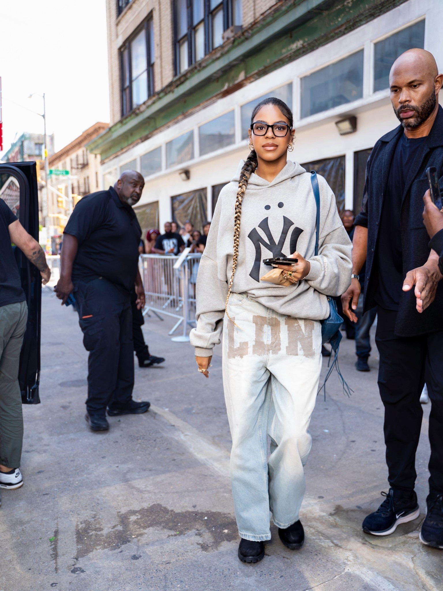 The daughter of Beyoncé and Jay-Z was recently spotted stepping out in New York City in a laid-back but considered street style moment. She wore a Fear of God Essentials MLB New York Yankees hoodie in heather grey, paired with $190 Jaded London LDN Mud XL Colossus Jeans — the oversized, distressed denim style featuring the brand’s signature “LDN” print across the thigh.