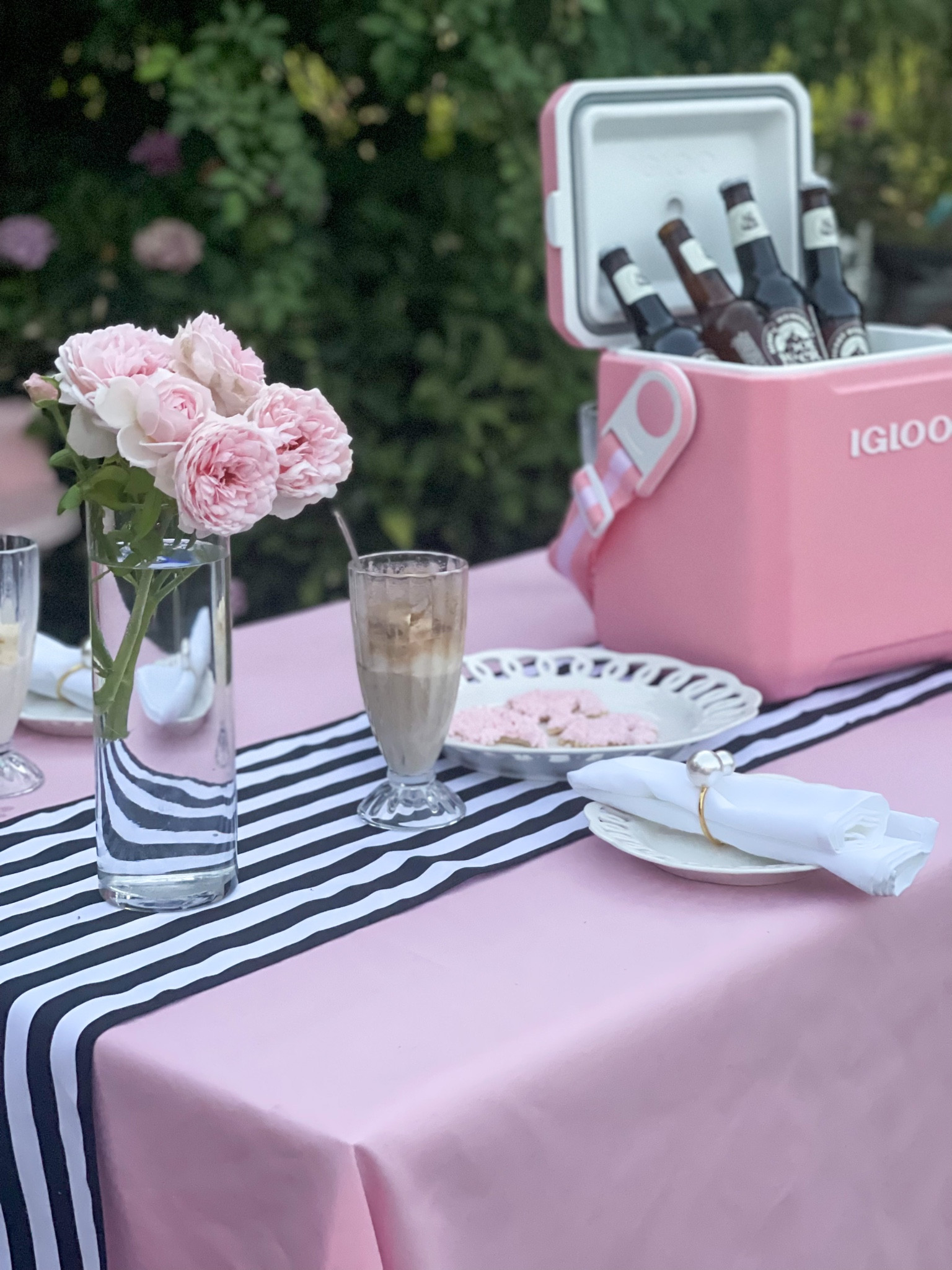 Pink tablescape. Barbie-inspired cookies. Summer tablescape. Pink Igloo cooler. Black and white stripe table runner. Amazon outdoor dining table. Walmart vase. 💗🤍🖤💗

#LTKhome #LTKFind #LTKunder50