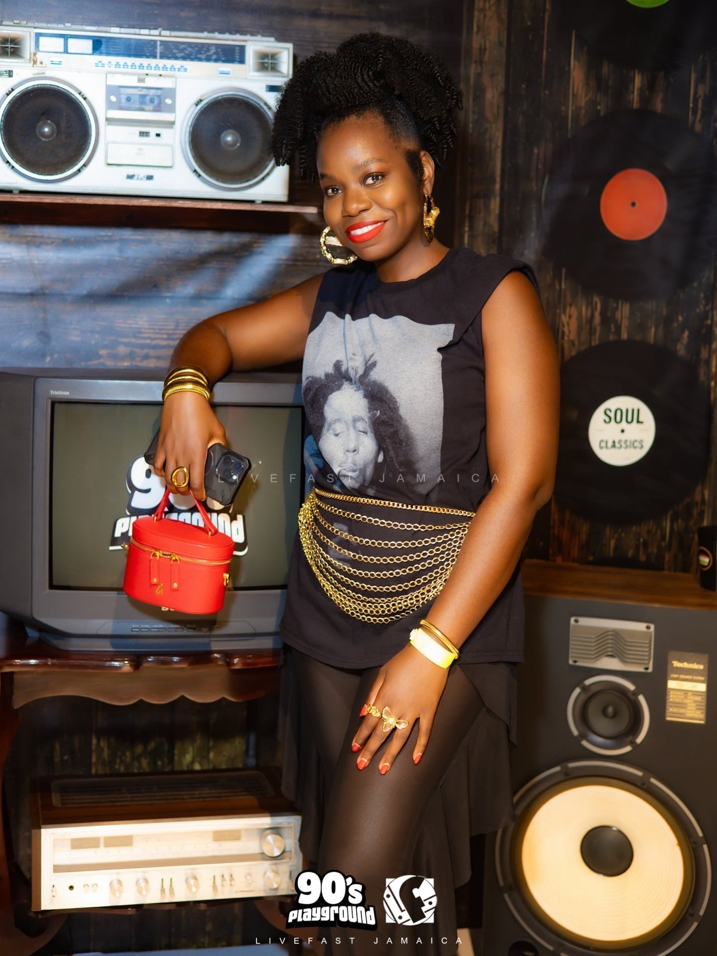 A quick, easy and comfortable fit for a 90s themed Dancehall party. I paired this intentionally oversized black t-shirt with black sheer pants, gold accessories and a red bag for a pop of color.

#LTKootd #LTKTravel