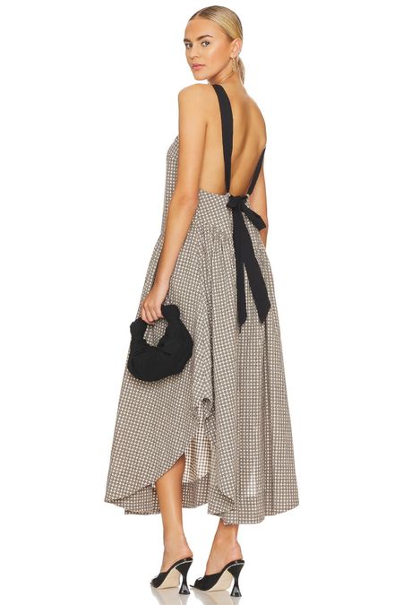 Black and white linen midi with a ruffle hem. Love the back detailing!

#LTKstyletip