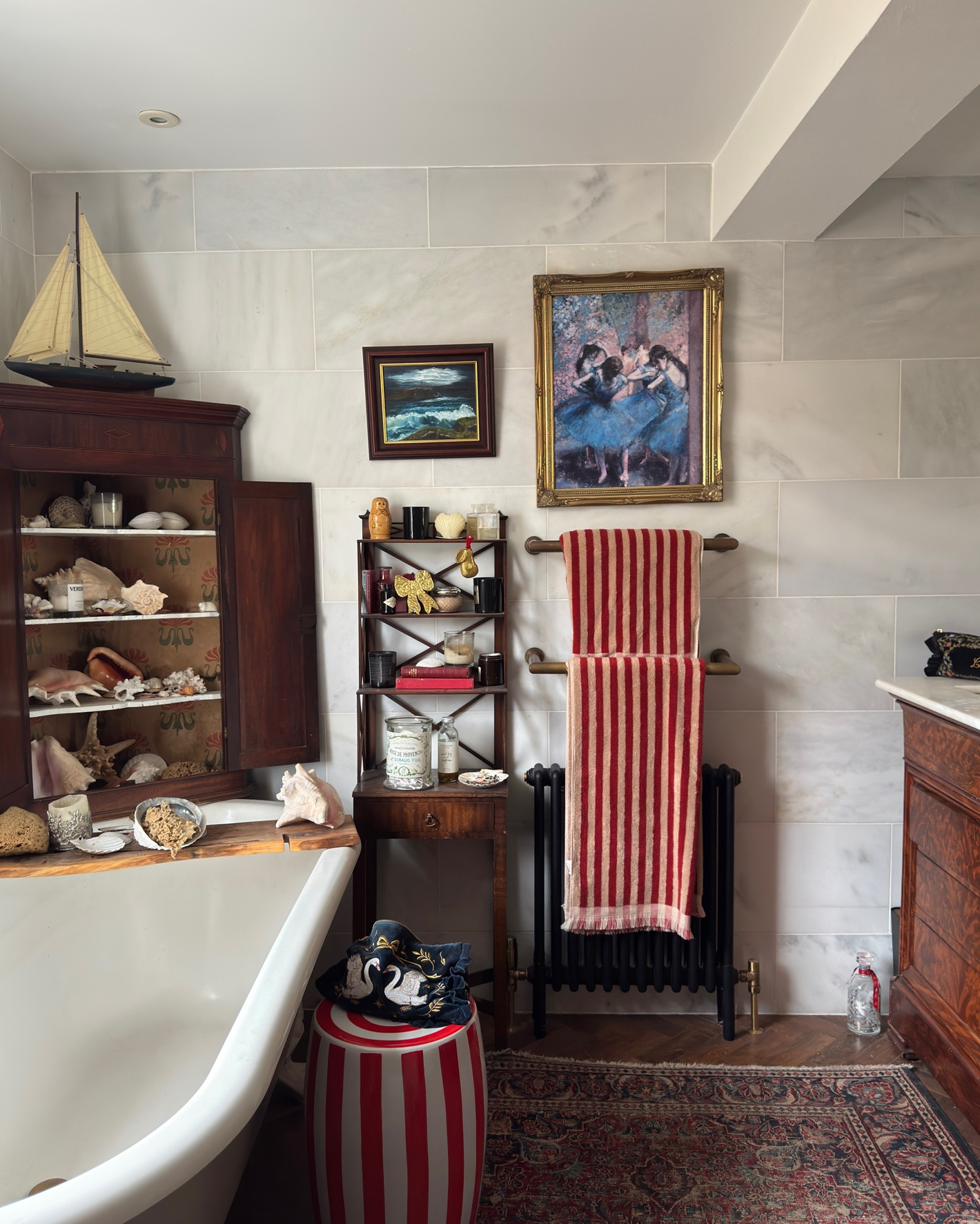 Red Striped towels adding a bit of fun in a vintage bathroom