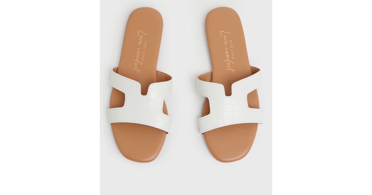 White Faux Croc Cut Out Sliders
						
						Add to Saved Items
						Remove from Saved Items | New Look (UK)