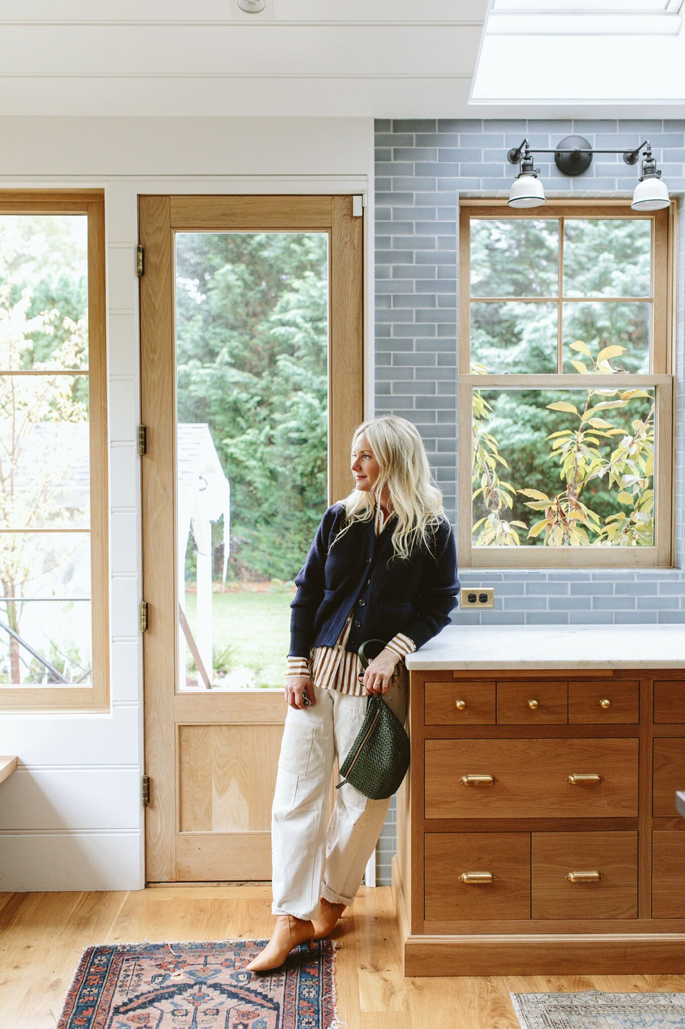 I recently bought this striped button-up which I’ve worn a lot because it’s so good to layer under thicker sweaters. Many poplin or cotton shirts can be too stiff to layer under anything that is fitted (they bunch in the armpits and wrists), but this one is satin-y (polyester probably) and is super thin so it layers and drapes really easily. I’ve had that cardigan for years but those are my new barrel pants that I love (and they are thick and good for cool weather).

#LTKshoecrush #LTKSeasonal #LTKstyletip