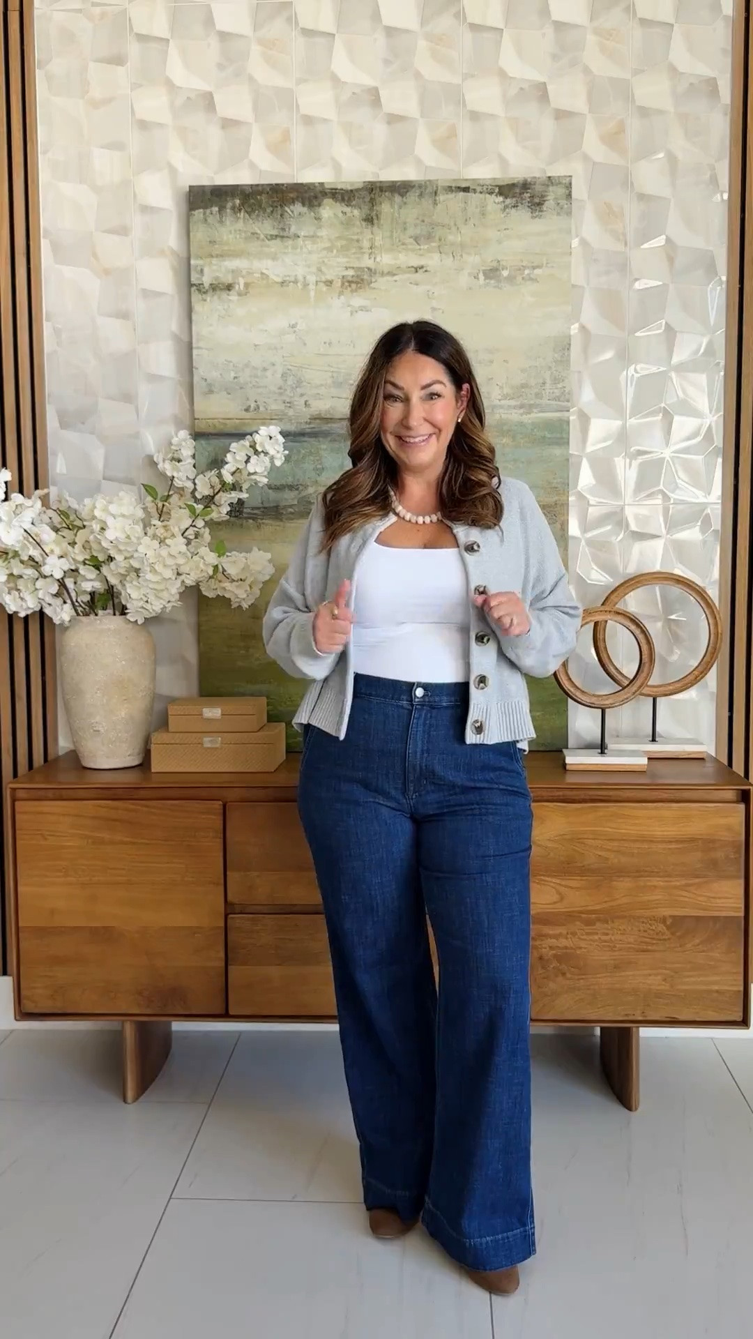 Easy fall layering 🤍 Heather blue cardigan with gold buttons over a white tank, paired with dark wash wide-leg jeans, a cognac tote, and brown booties. A comfy, polished smart-casual look for errands, work-from-home, or school pickup.

Sizing: jeans tts, 31 | tank, XL | sweater, L 

#LTKfindsunder50

#LTKOver40 #LTKMidsize #LTKMidsize #LTKOver40 #LTKWorkwear