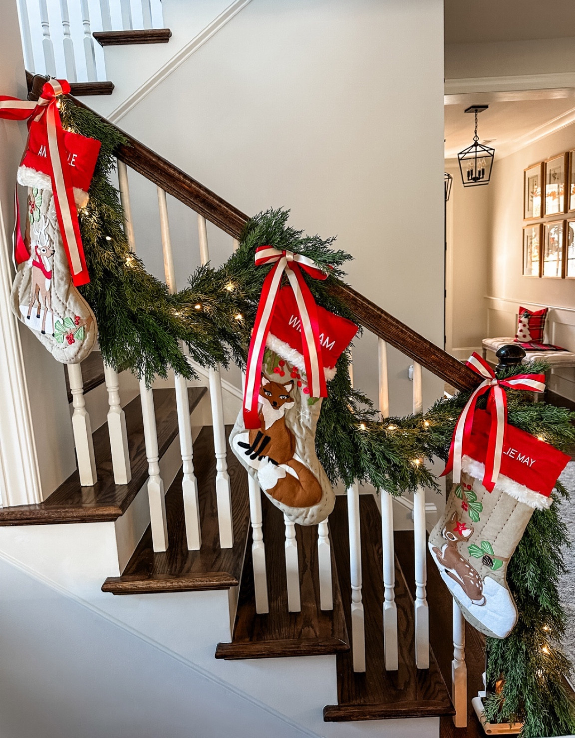 Stair railing garden stockings and lights and ribbon! Beautiful for your Christmas garland and railing 

#LTKhome #LTKSeasonal #LTKHoliday