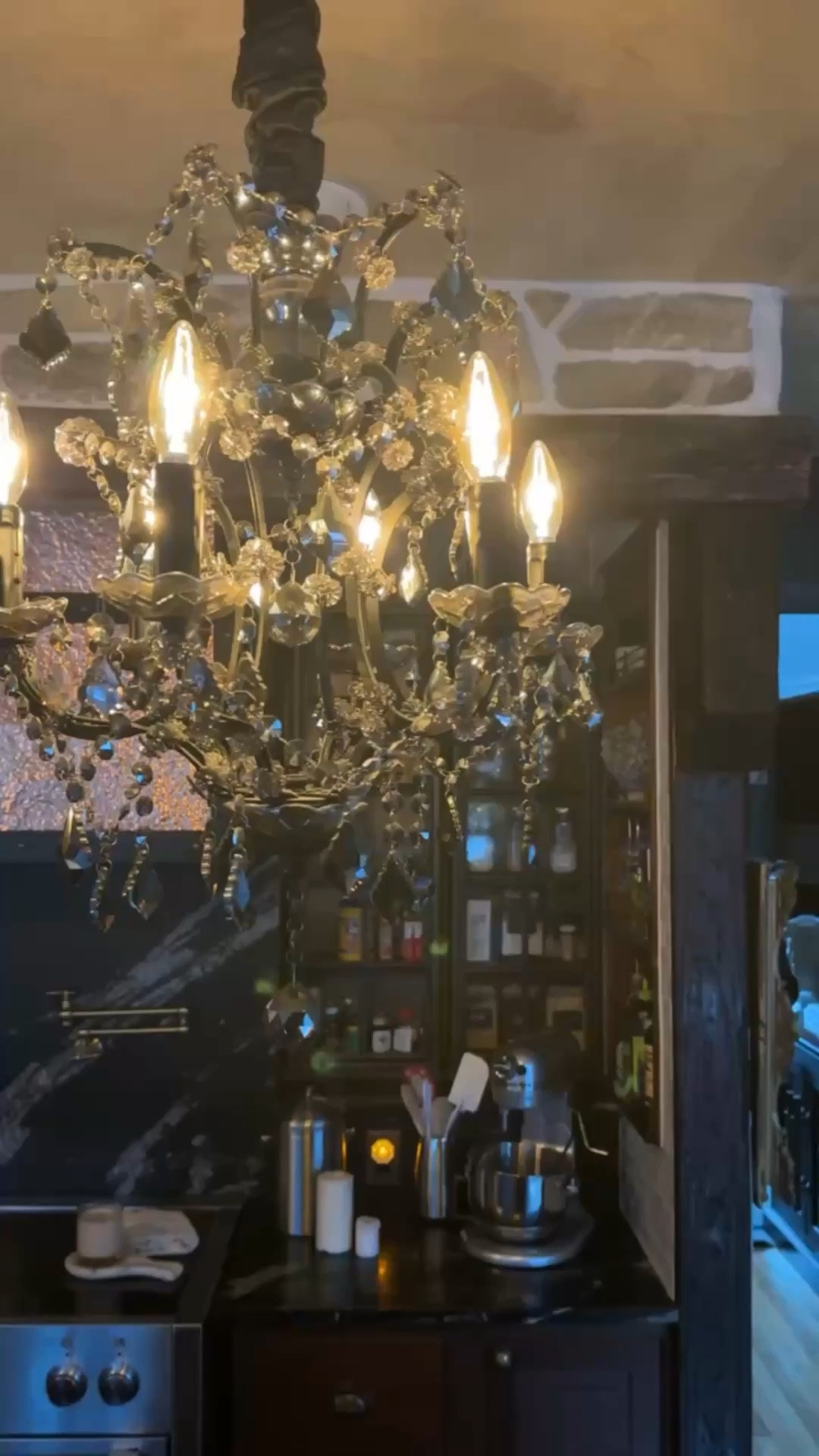 A dark smoky chandelier that adds instant drama to the kitchen. Rich tones and soft glow create a moody focal point that makes the whole space feel elevated and atmospheric. ✨ 

#SmokyChandelier #KitchenLighting #MoodyInteriors #StatementLighting #TimelessStyle #HomeDecor #DesignDetails #callsigndesign