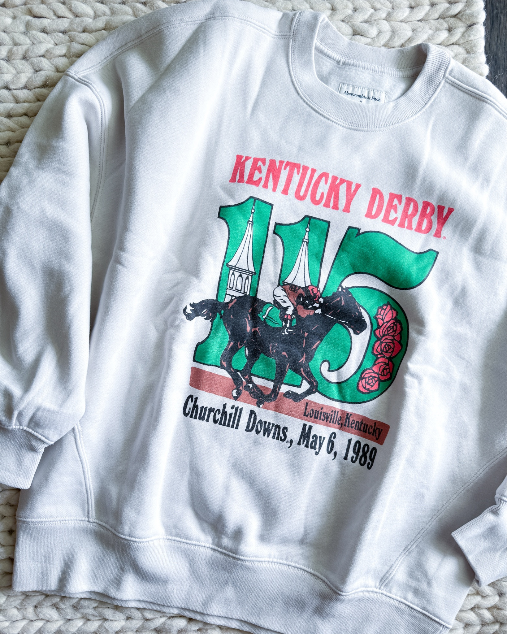 This Abercrombie Kentucky Derby sweatshirt is giving vintage varsity energy in the best way. I sized up to a small for that slouchy, oversized look. It’s perfect with denim cutoffs, layered over a mini dress, or with leggings or joggers. 

abercrombie kentucky derby sweatshirt – vintage graphic sweatshirt – oversized crewneck pullover – retro abercrombie style – casual graphic outfit – horse race sweatshirt – comfy oversized sweatshirt – throw on and go outfit – easy weekend layer – abercrombie loungewear style – effortless casual outfit – trending graphic sweatshirt – abercrombie sweatshirt styling tips

#LTKActive #LTKStyleTip #LTKU