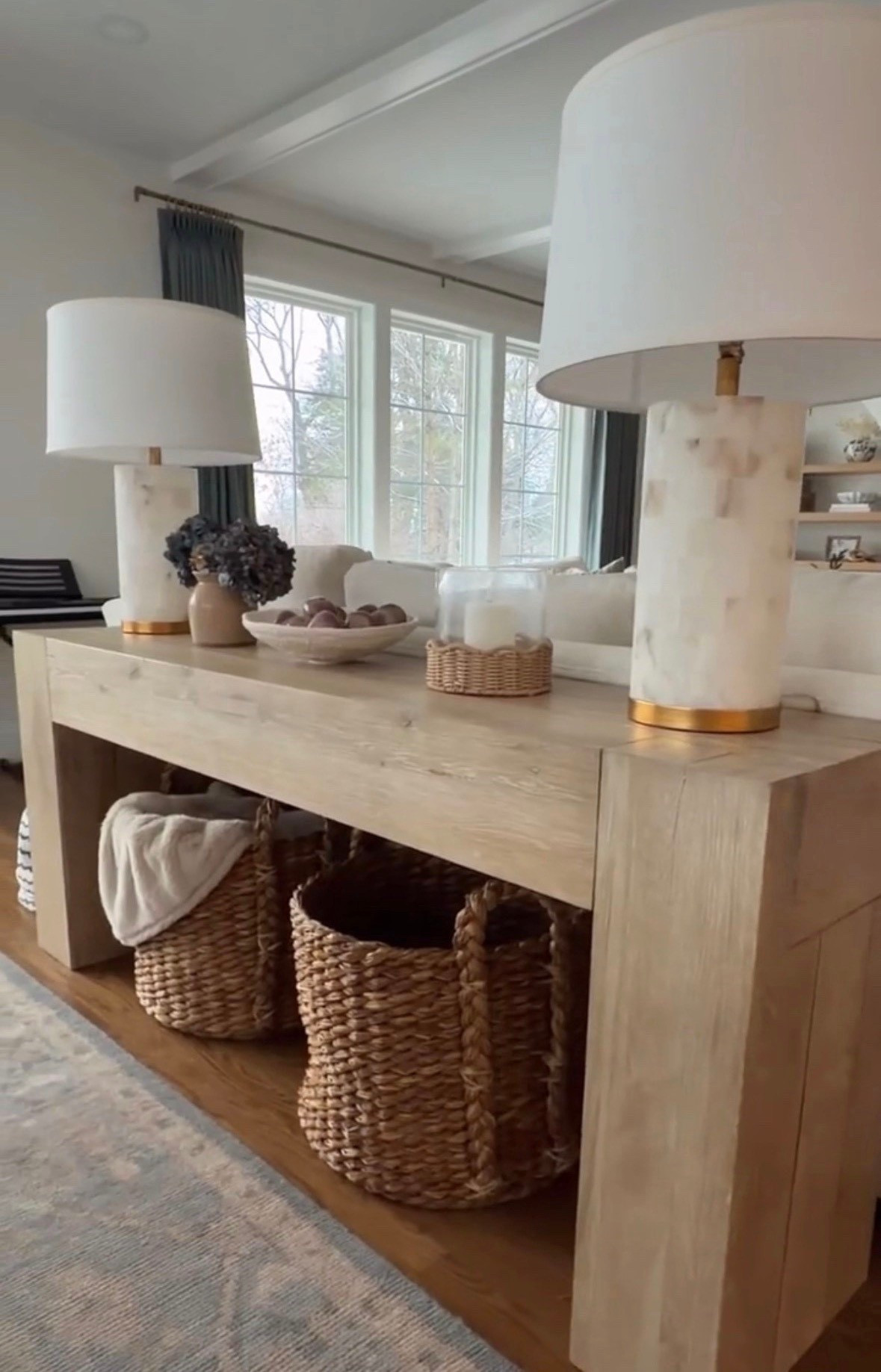 Loving the way these new baskets from Target look under my family room console table. Great for storing extra blankets or pillows! 

#LTKHome