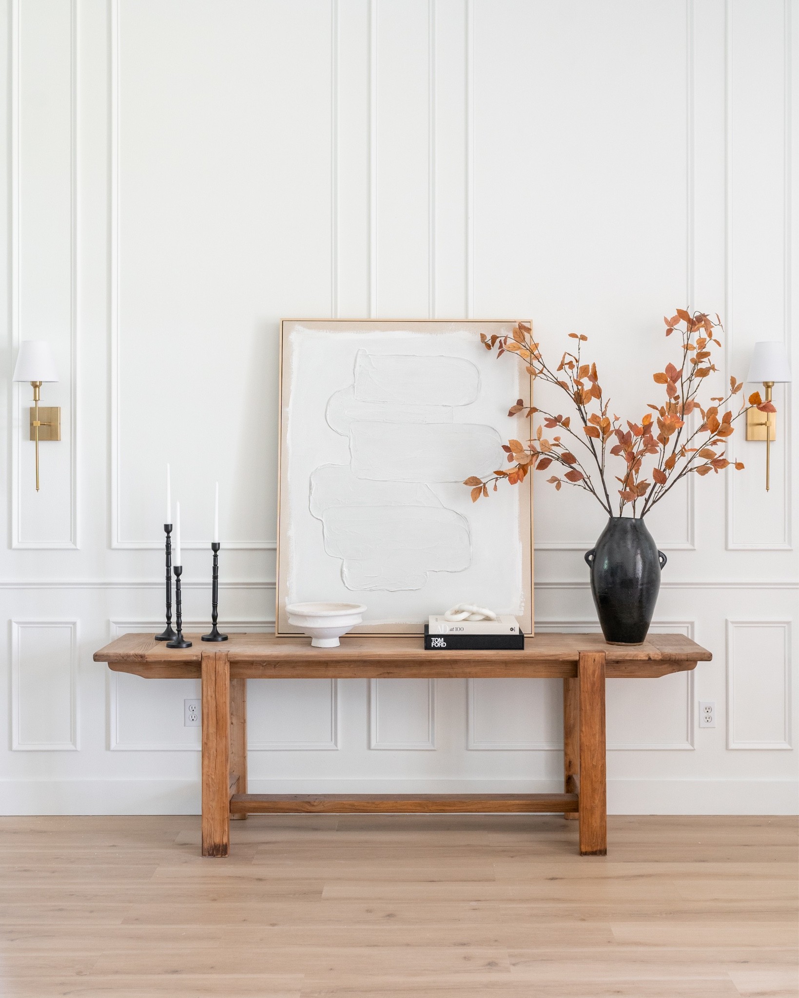 Our console table decor! Love this long wood console table, tall black vase, fall branches, black candleholders and abstract plaster artwork. The gold wall sconces are an Amazon find!

 Neutral decor, console table decor, transitional decor, modern decor



#LTKhome