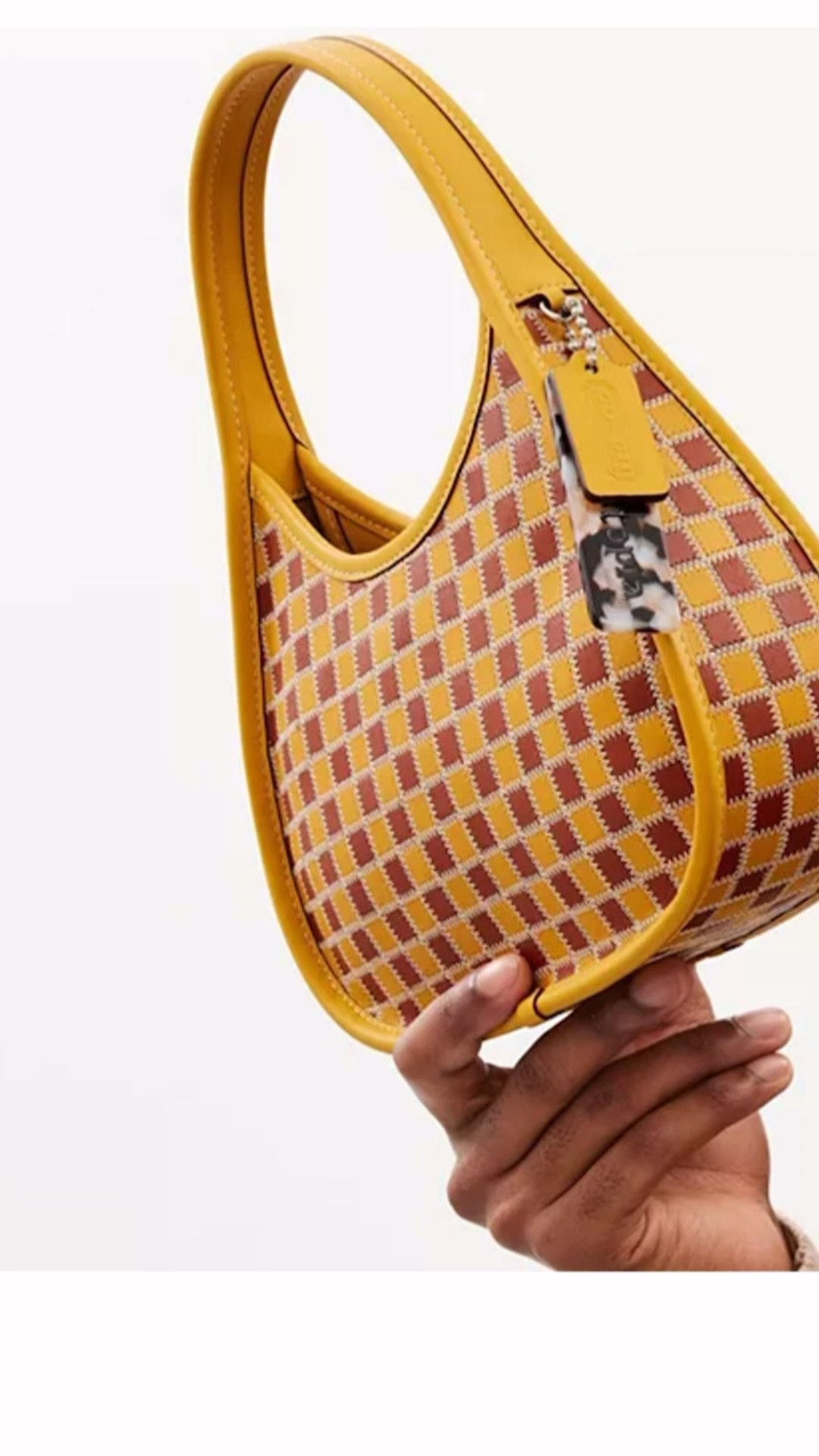 Ergo Bag in Checkerboard Leather
Coachtopia
Buttercup/Rust

* Top handles, 6.3" drop
* Dimensions: 9.8"L x 3"D x 6"H
* Magnetic snap closure

#LTKStyleTip #LTKItBag #LTKWatchNow