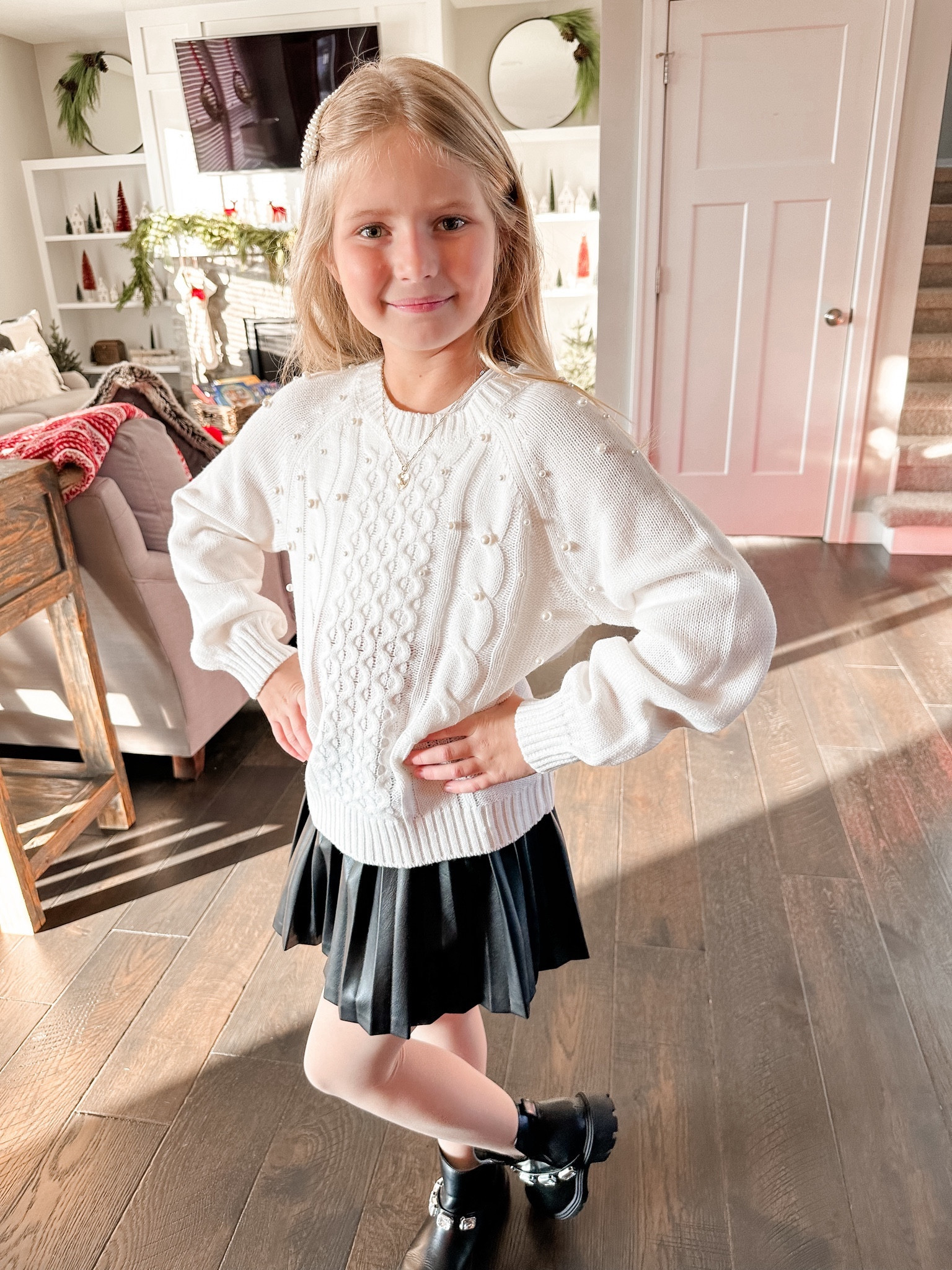Black, pleated skirt
Girls fashion 
Pearl adorned sweater 