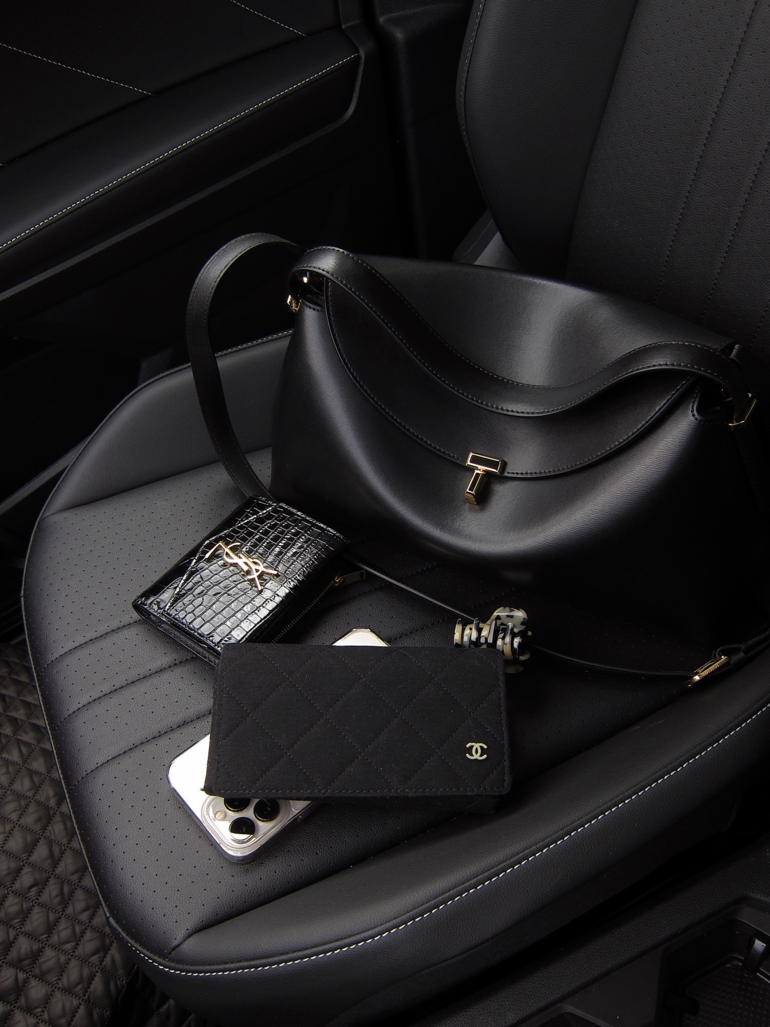 Toteme T Lock black leather bag | top handle bag | crossbody bag | Crown Affair hair clip | Chanel sunglasses | YSL black leather croc embossed wallet 

#LTKItBag #LTKSeasonal #LTKStyleTip