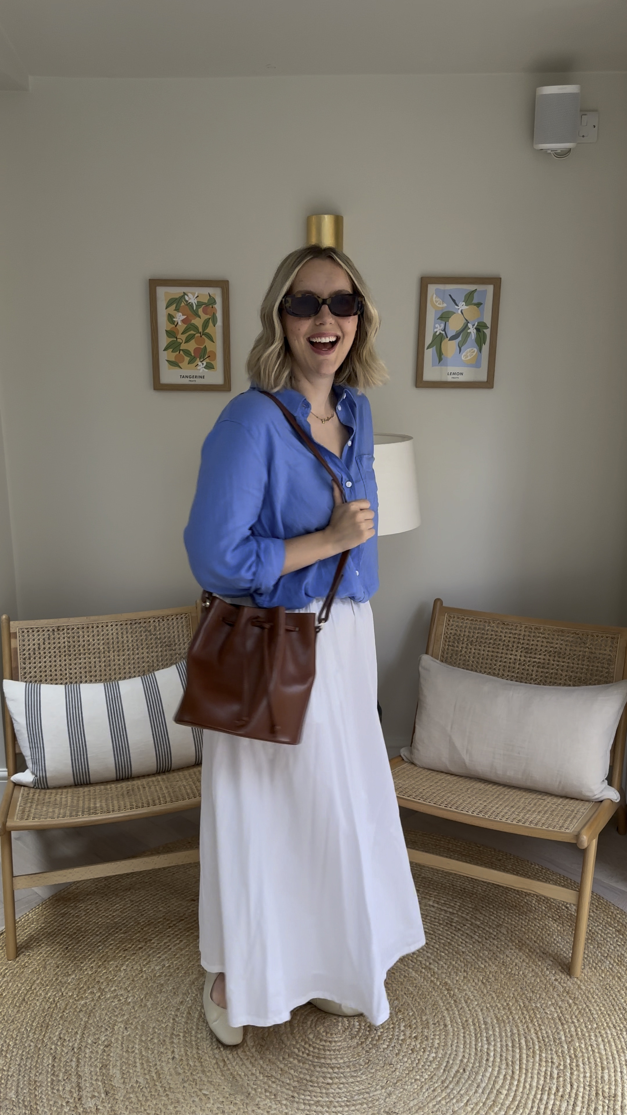 Fashionable work outfit for the office or WFH. 
M&S Shoes and white maxi skirt (size 10), H&M blue linen shirt (size M), Sezane bag and ASOS sunglasses  

#LTKworkwear #LTKsummer #LTKuk