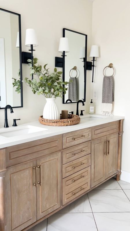 Bathroom Inspo - bathroom vanity back in stock! We did remove the gray marble top and replaced with white quartz top. 

Bathroom, bathroom cabinet, bathroom vanity, bathroom faucet, wall mirror, wall sconce, shaded sconce, bathroom lighting, hand towel, Turkish towel, vase, bathroom decor, home decor, round tray, faux greenery, champagne bronze hardware, amazon home, Amazon finds 

#LTKHome #LTKSaleAlert
